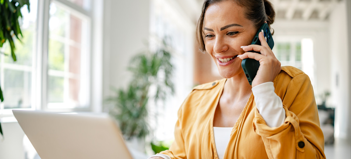 [Featured Image] An IT professional works at an office space, utilizing AWS services.
