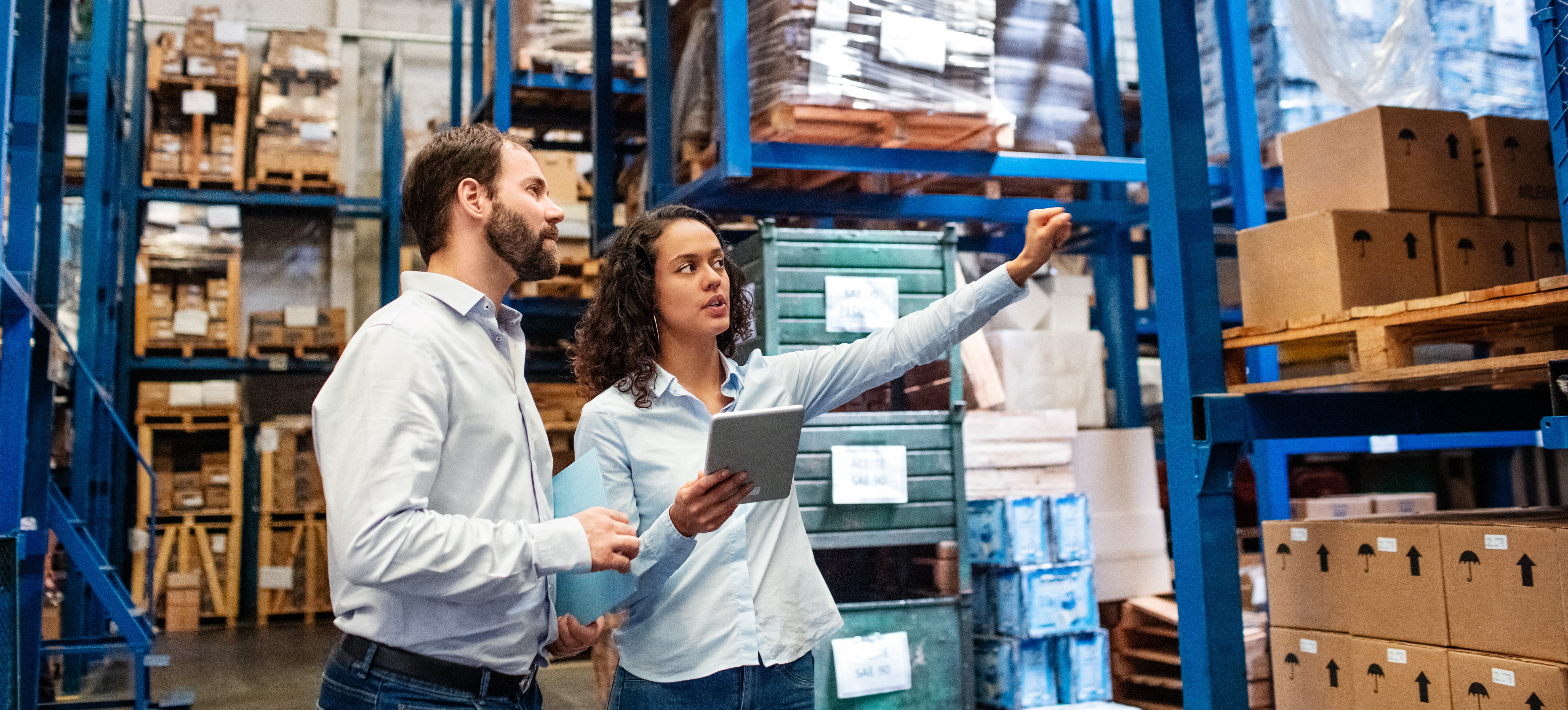 [Featured Image] A product manager is supervising a team member who is on the product manager career path and advancing toward the position.
