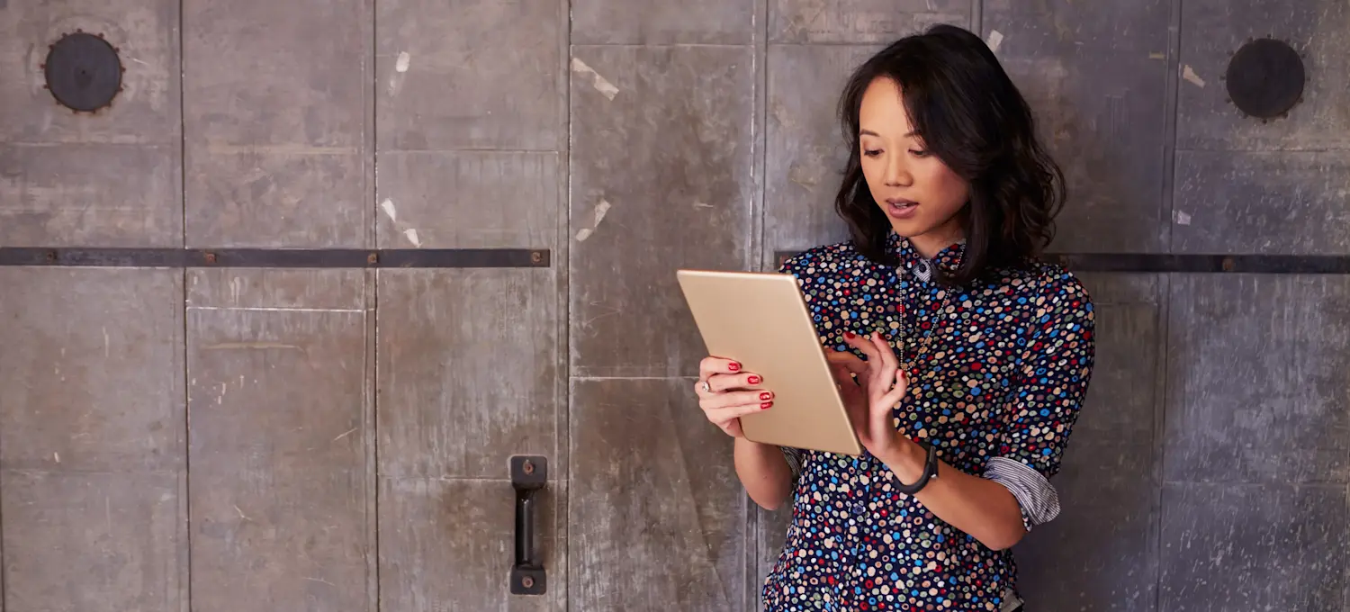 [Featured Image] A person works on a tablet.