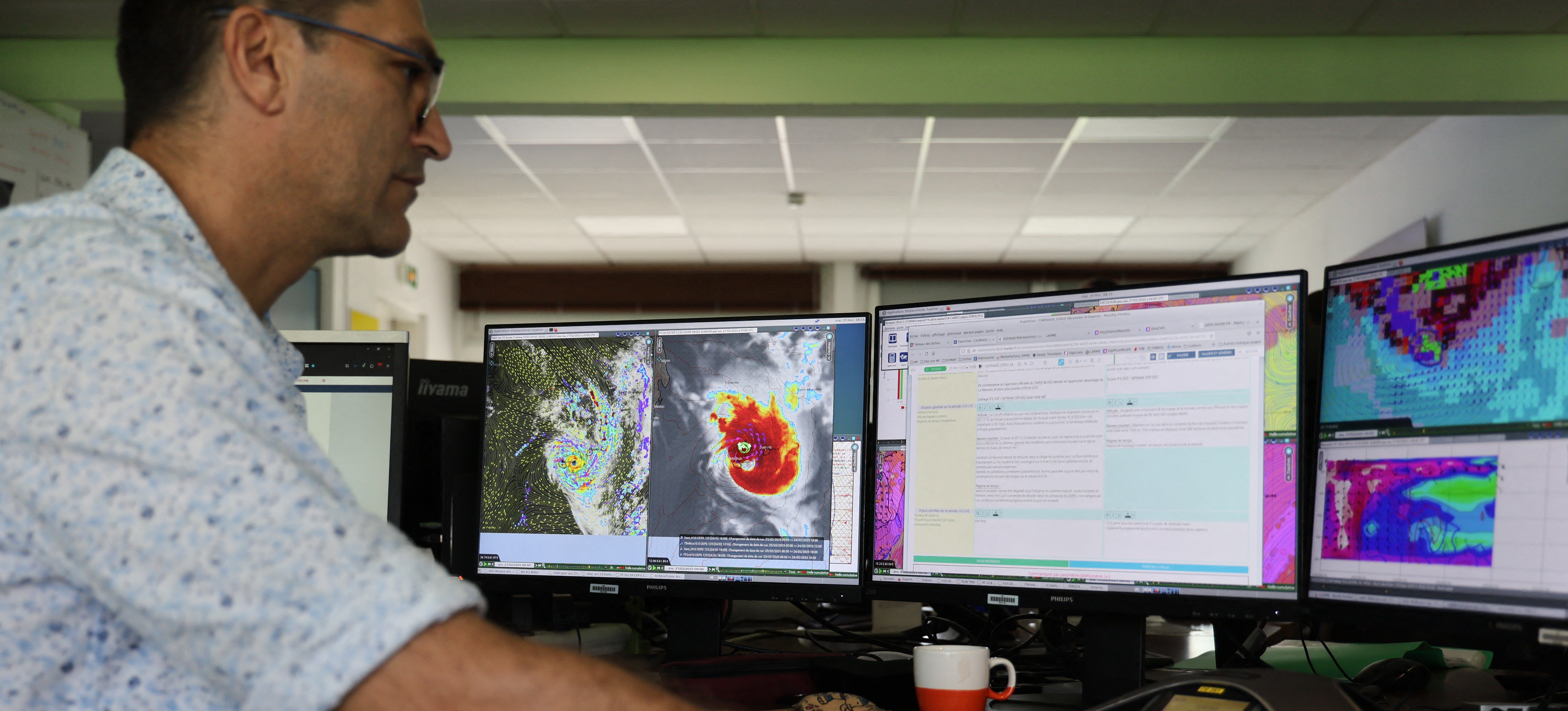 [Featured Image] A geospatial information scientist in a work environment analyzing images and data related to their field on a computer.
