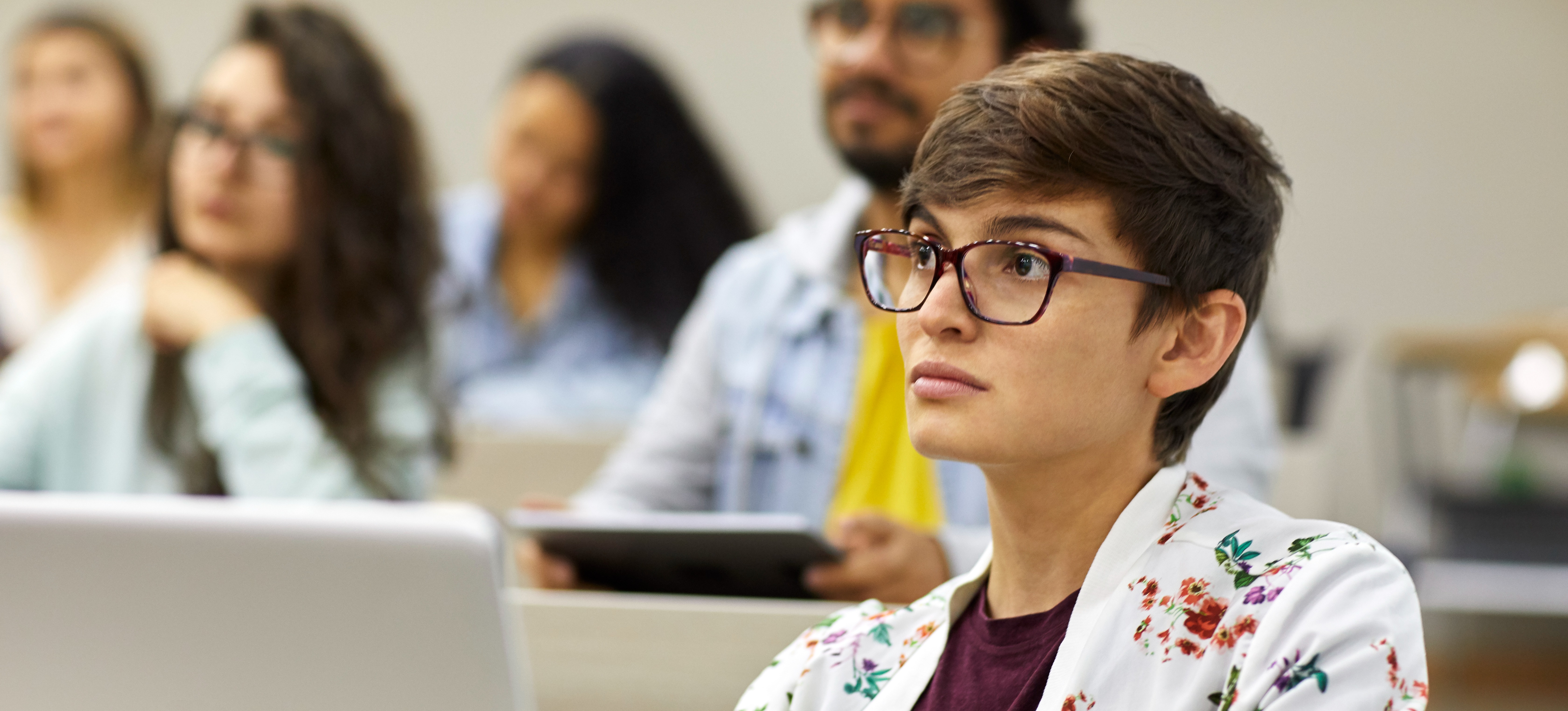 [Feature image] A student is seen attending a class at university. 
