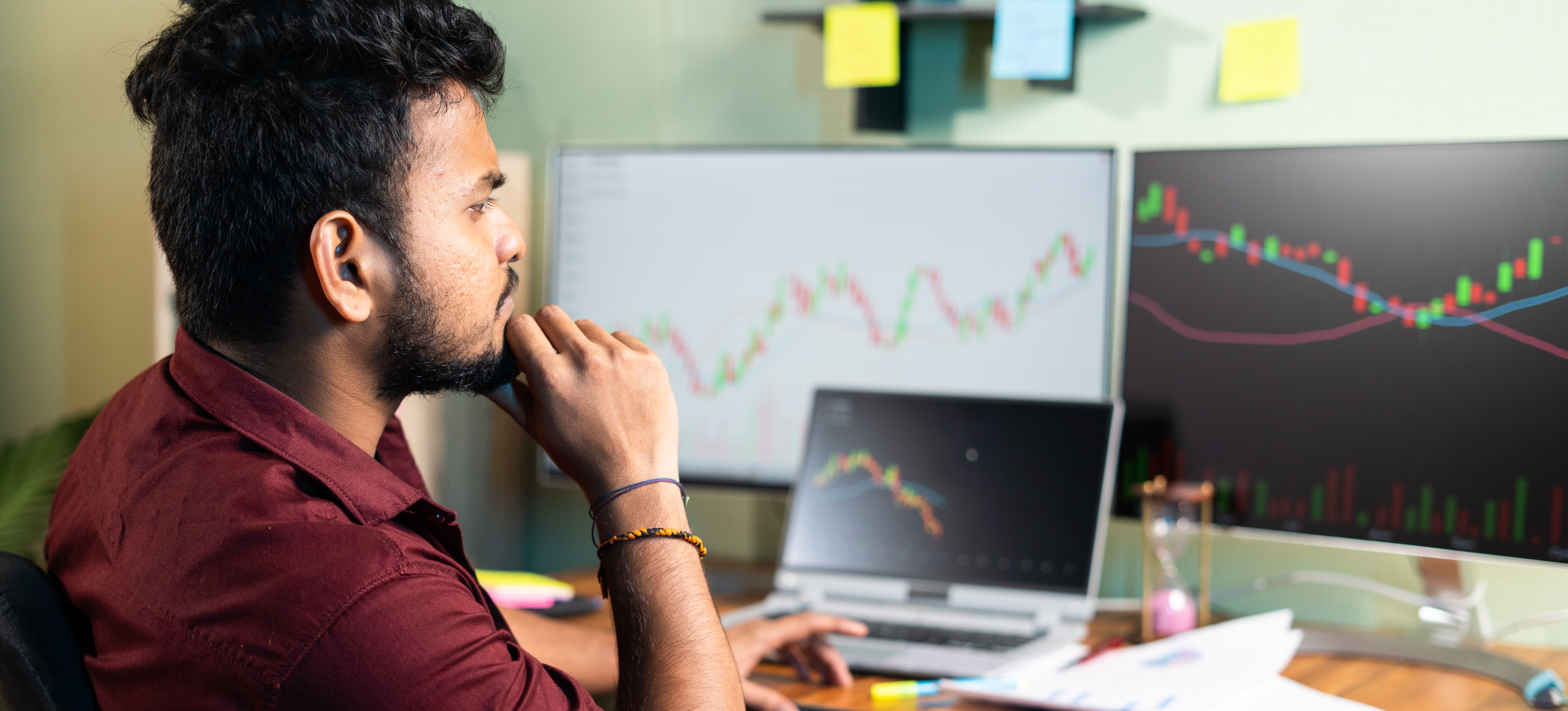 [Featured image]: A worker reviews data looking for evidence of correlation vs causation.
