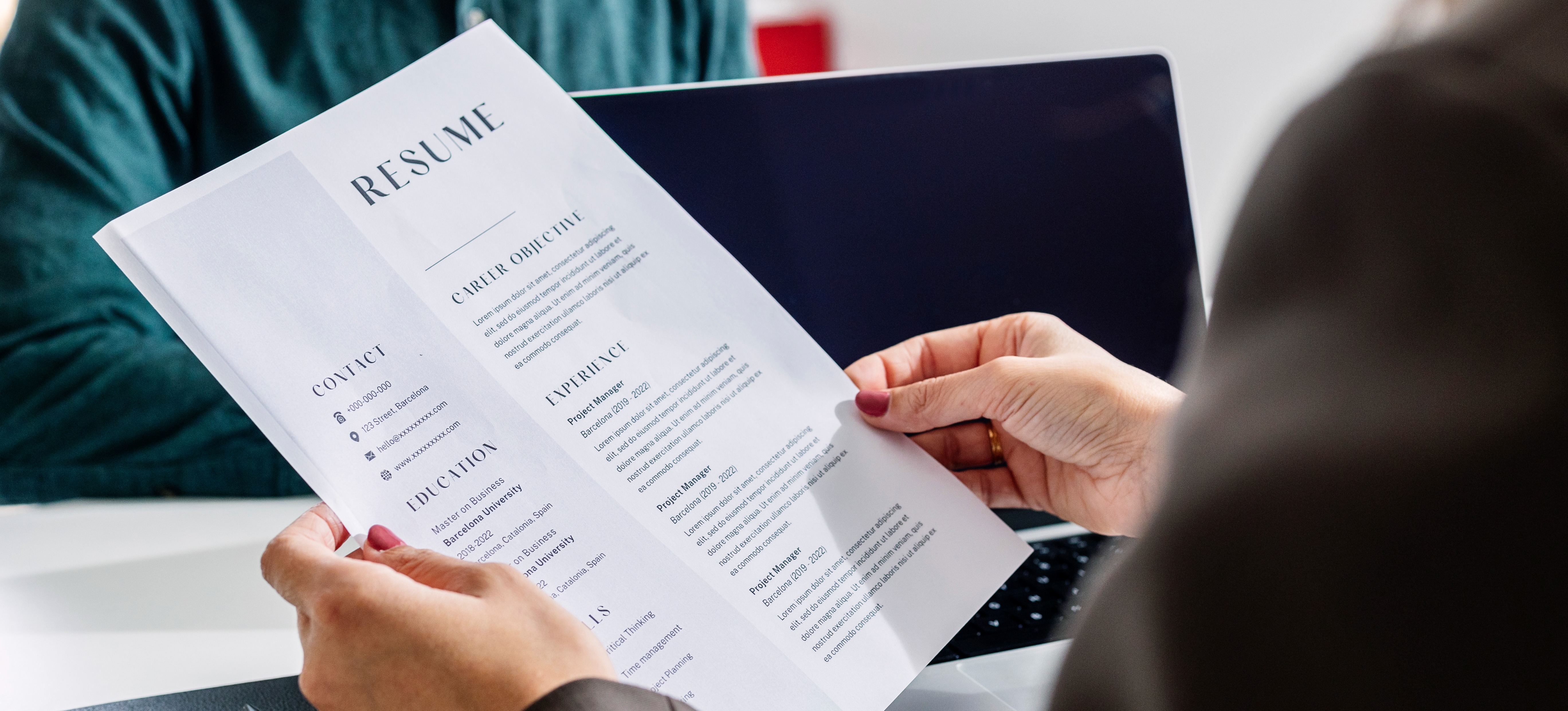 [Featured Image] After learning how to write a QA tester resume, an applicant secures a job interview and meets with a hiring manager. 
