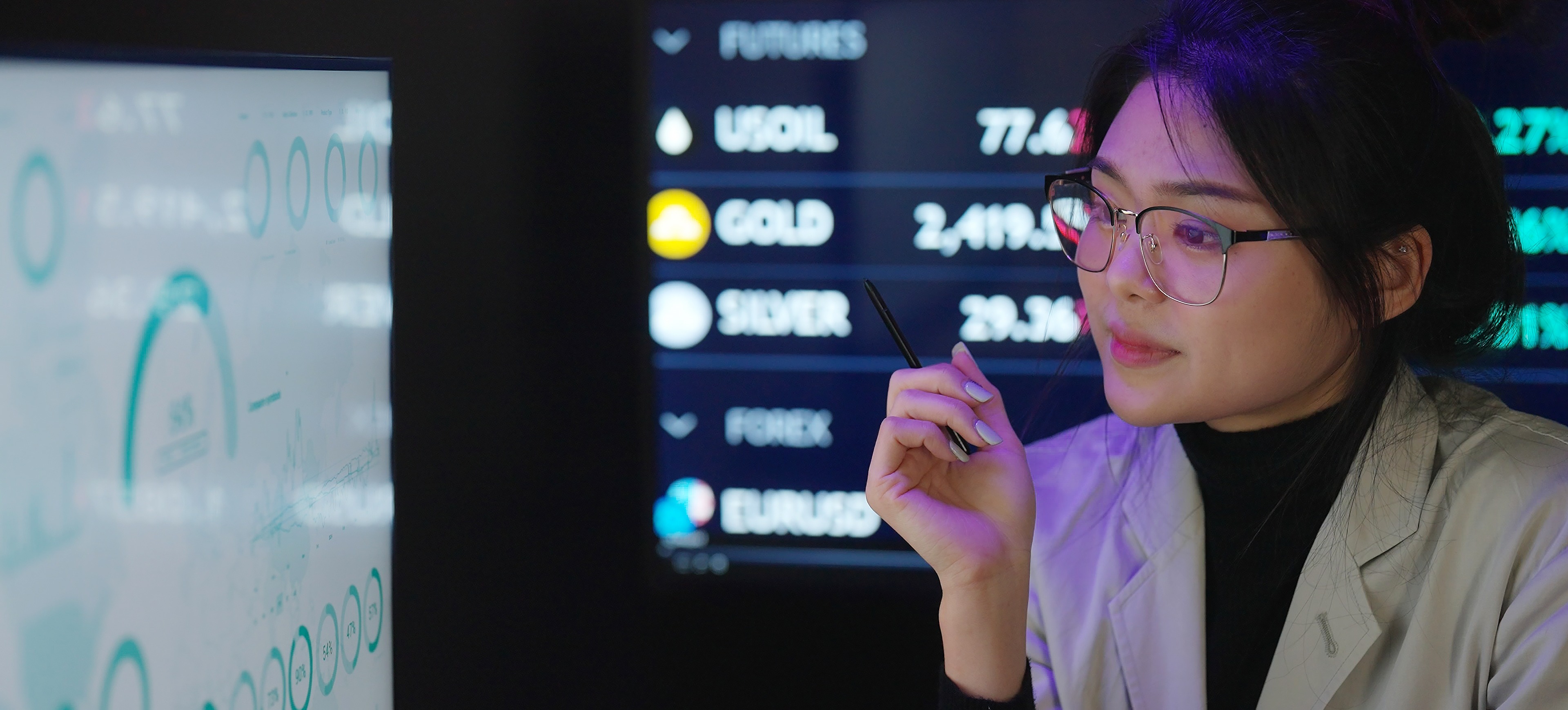 [Featured Image] A data architect studies financial data on a computer display. 
