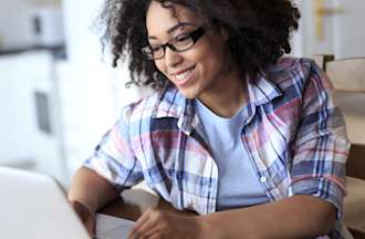 [Featured Image] A woman prepares to take the CRISC certification exam.