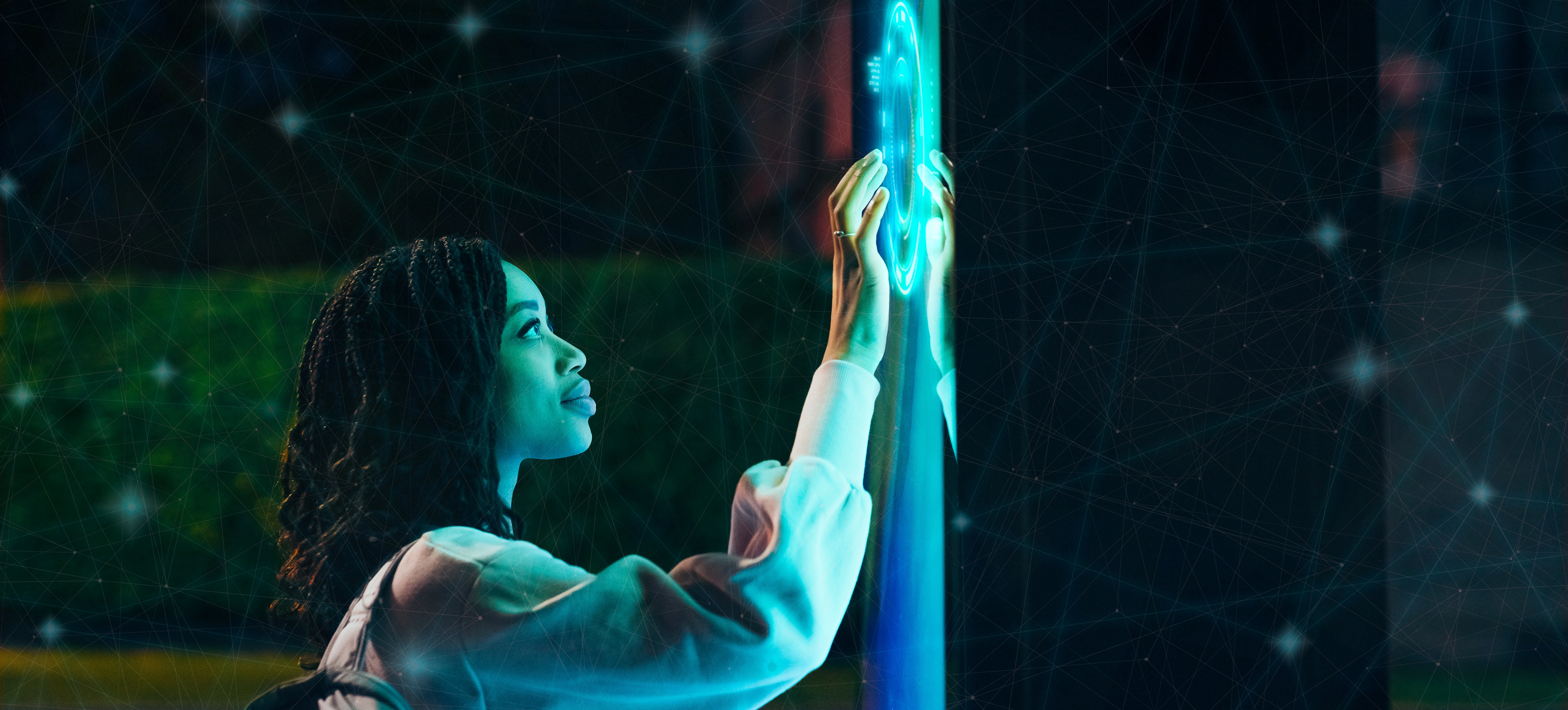 [Featured Image] A woman interested in an augmented reality (AR) job description touches an AR screen.
