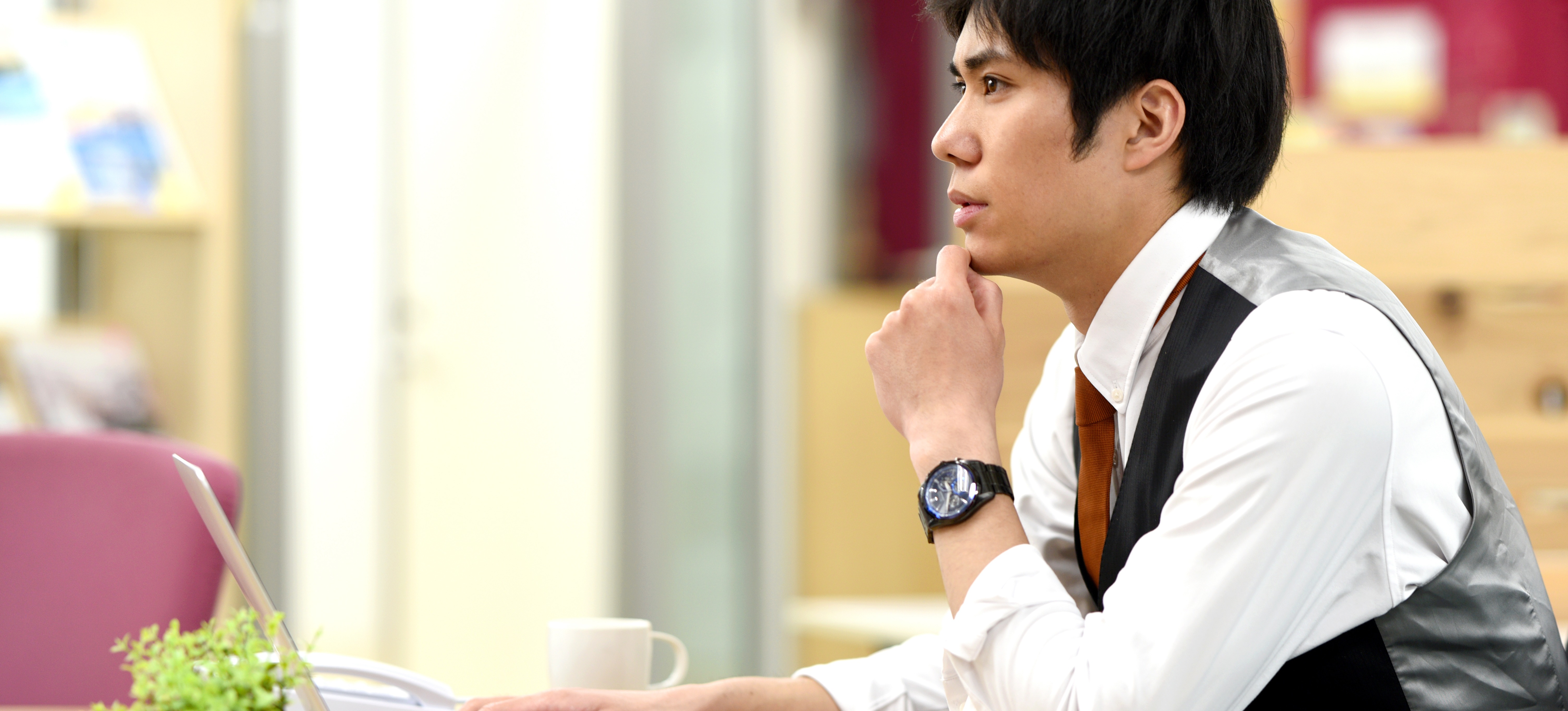 [Featured Image] A cryptologist works on a laptop, developing a security system for their company.