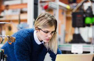 [Featured Image] A robotics engineer conducts research in a lab.