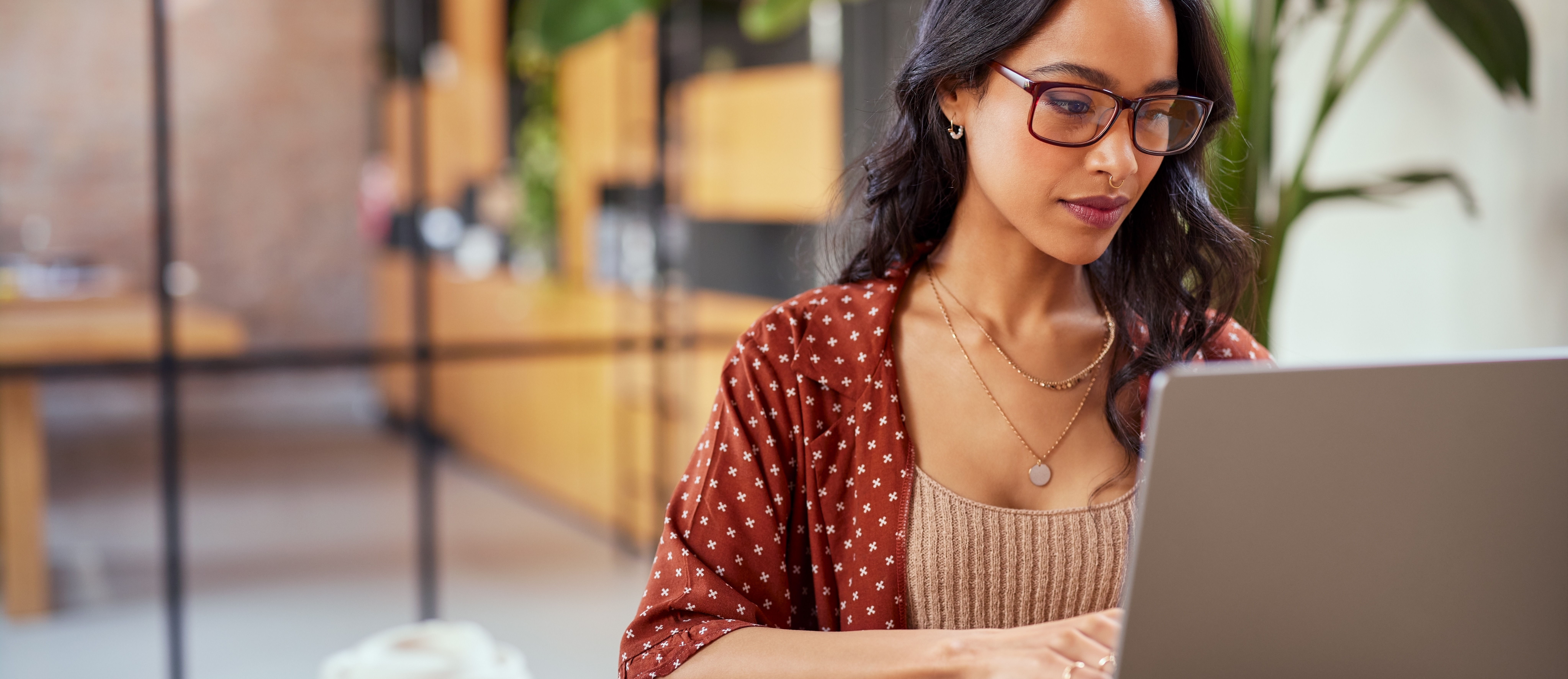 [Feature Image] An aspiring cloud computing professional searches for information on their laptop, querying “Which AWS exam should I take?”
