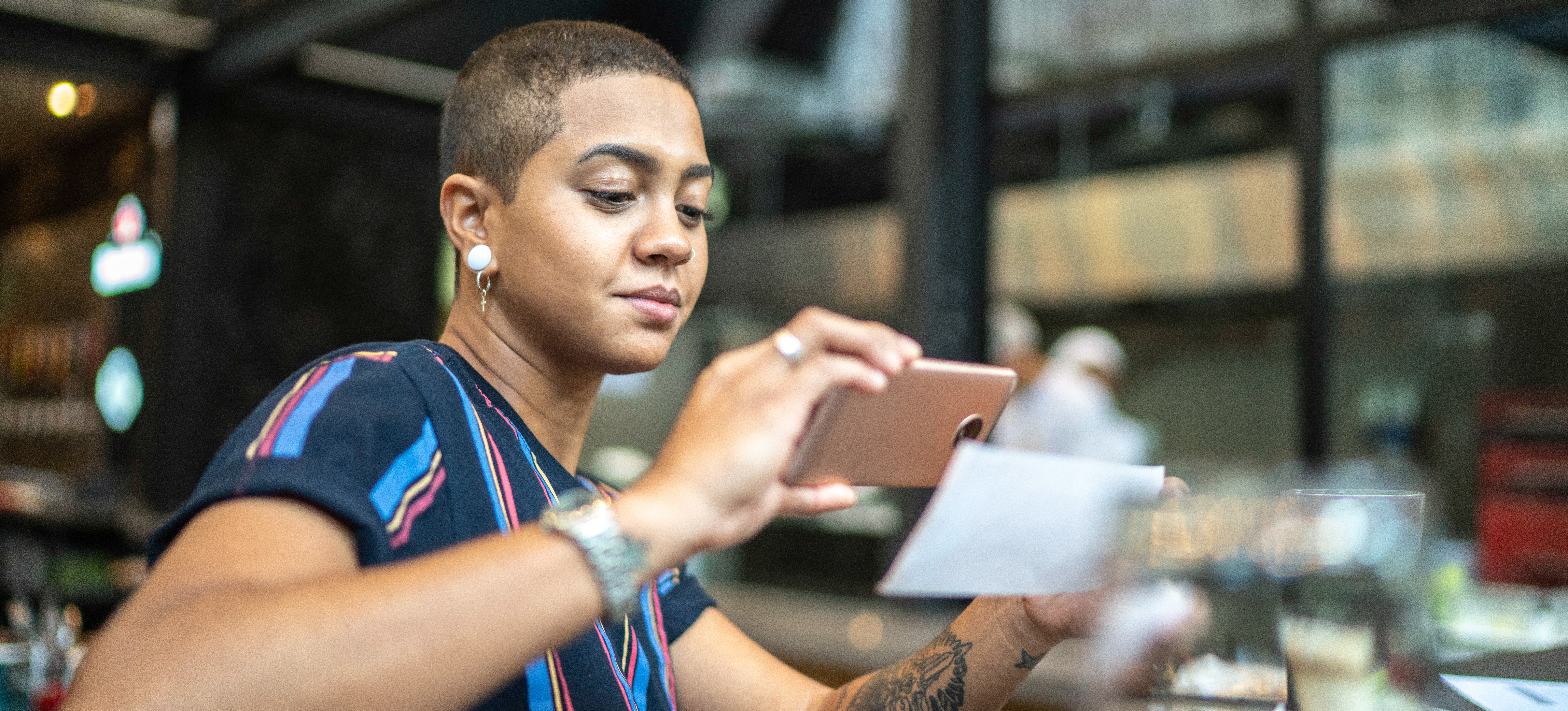 [Featured Image] An office worker is using OCR to scan a document on their phone.
