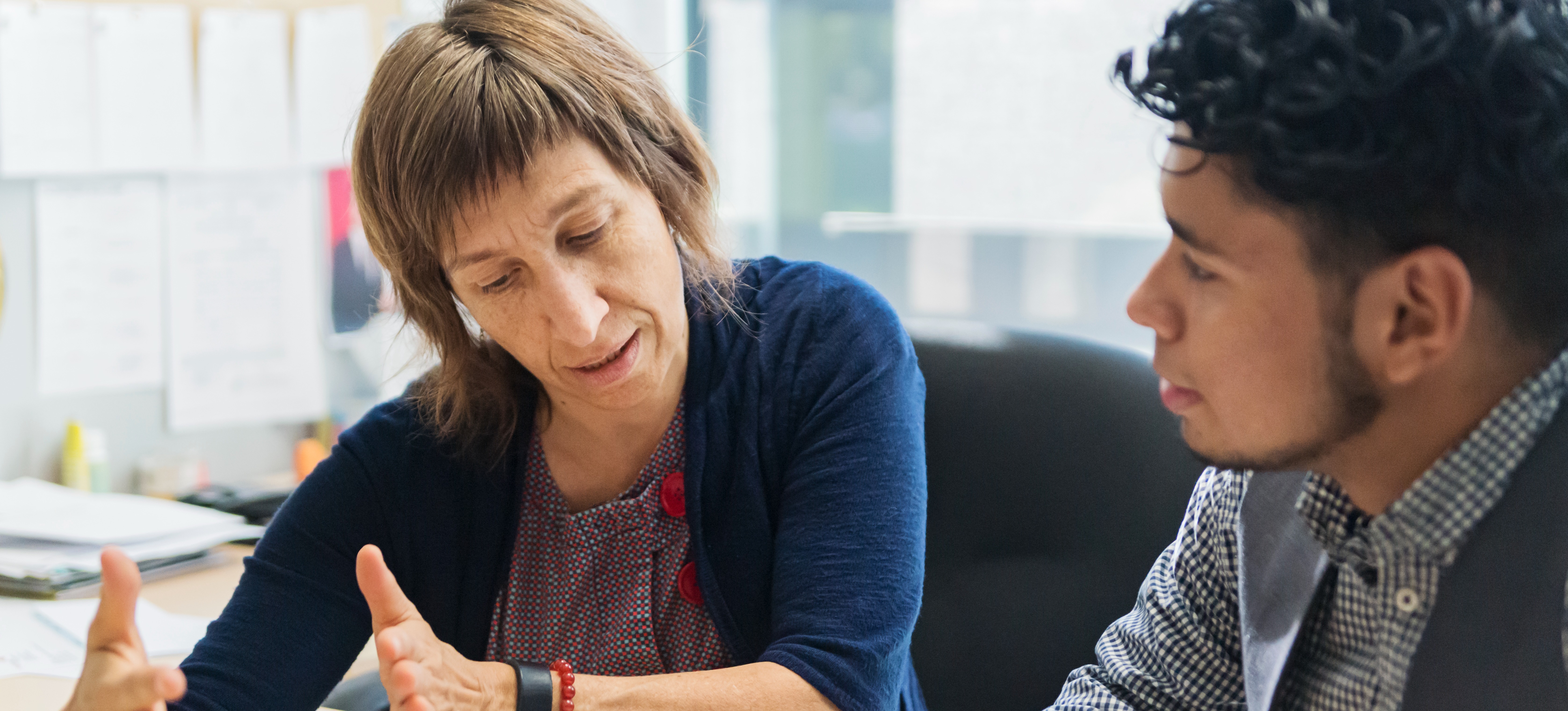 [Featured Image] A student meets with a careers advisor in their office and asks, "Can I go to university with no A levels?"
