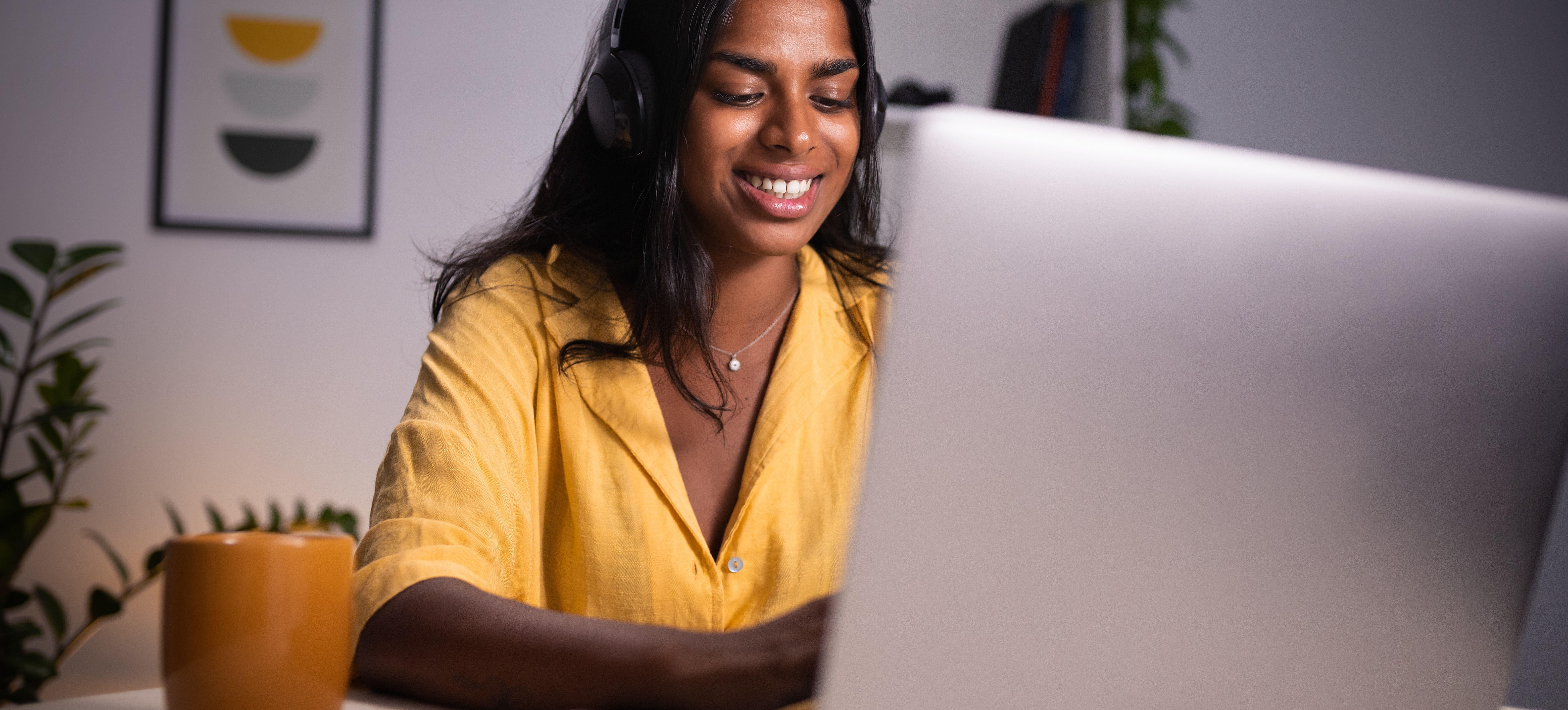 [Featured Image] A young university student is working on her laptop to ensure an online degree verification before enroling.