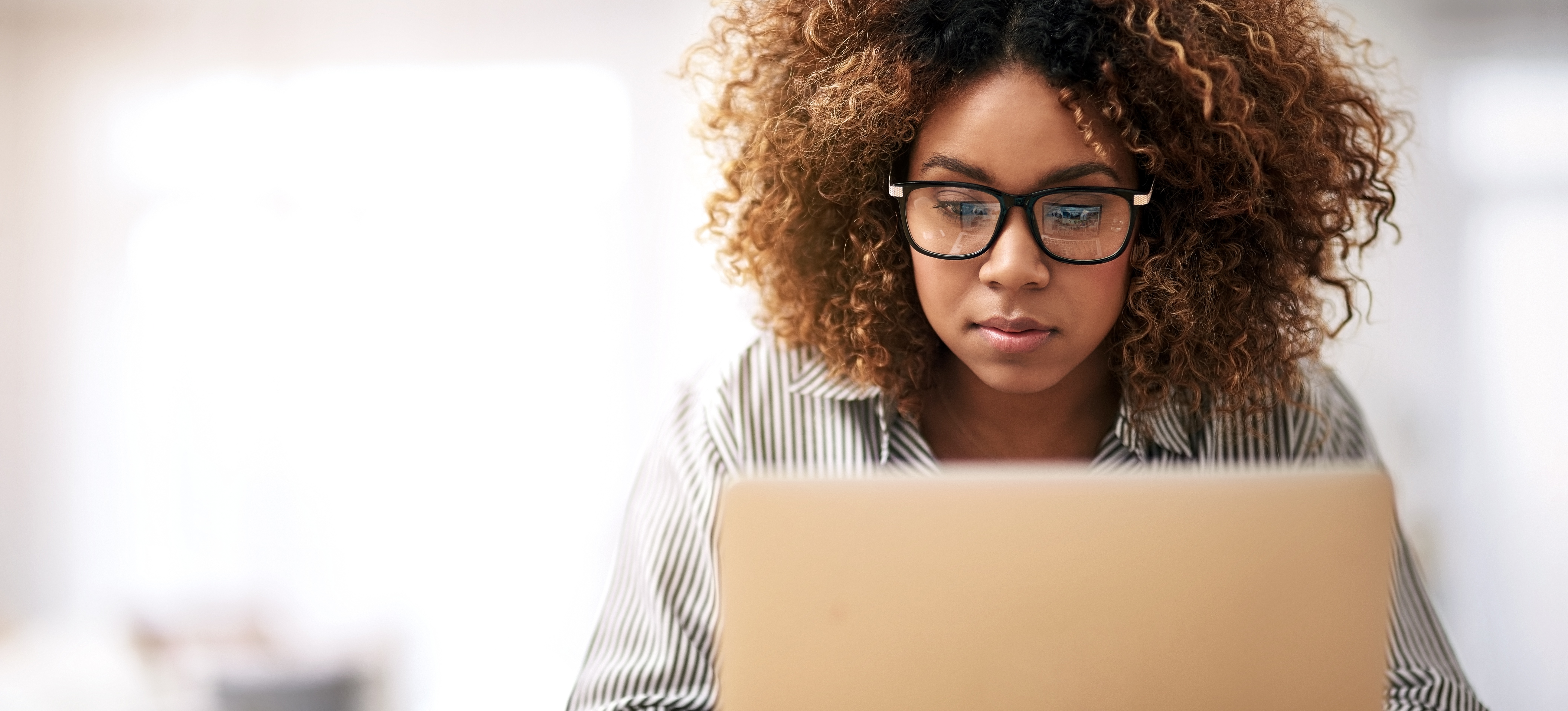 [Featured Image] A learner researches data science manager salary information on their laptop as they consider their career options. 
