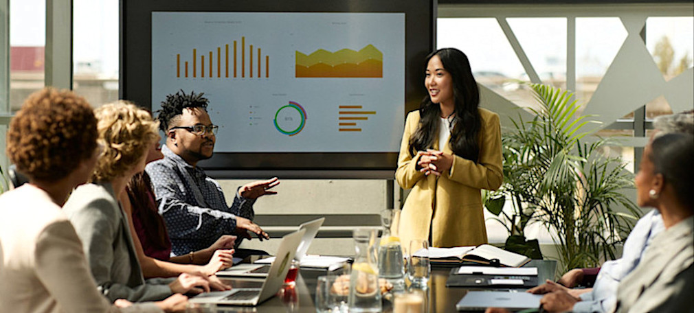 [Feature Image] A team of data professionals discusses the insights gained from using data modeling techniques and tools.