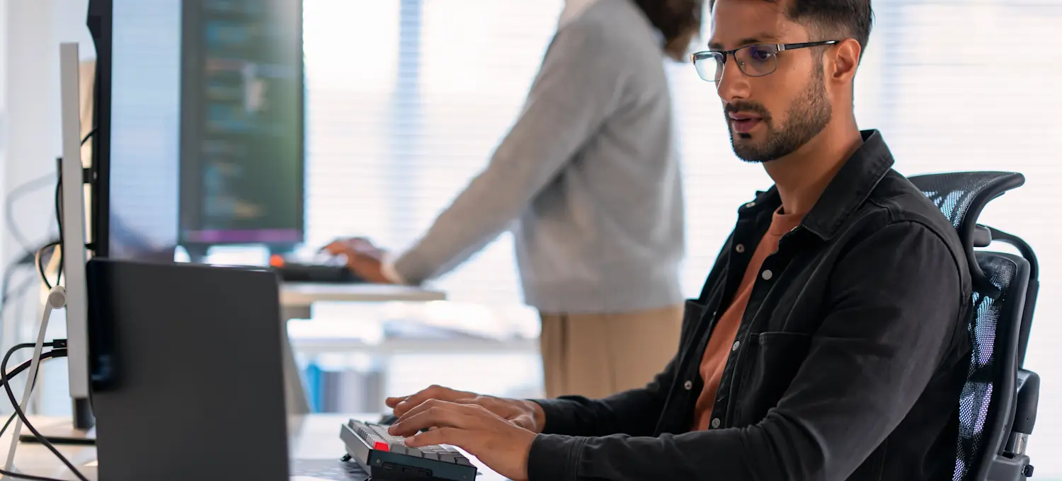 [Featured Image] A computer programmer is using the penetration testing technique to imitate a cybersecurity attack.