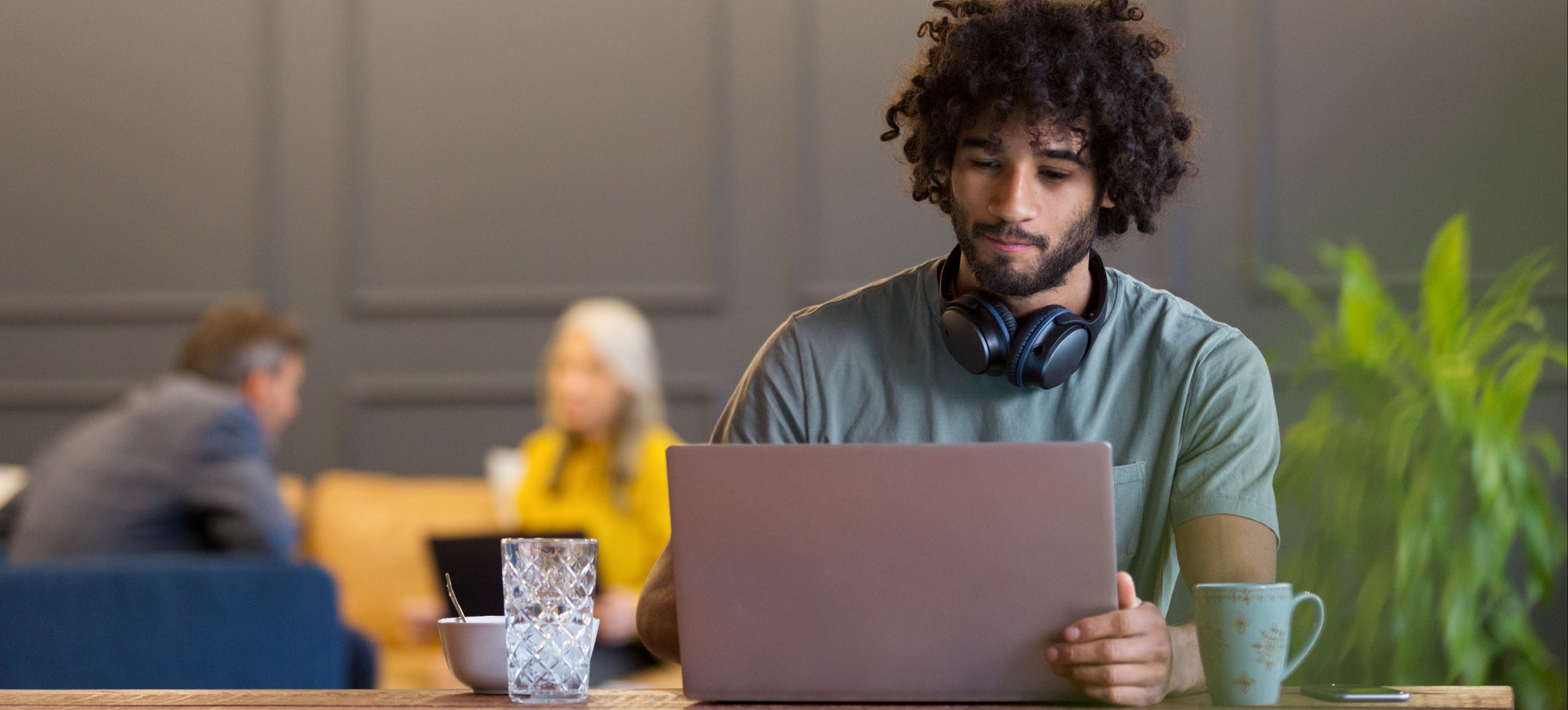 [Featured Image] A data manager works on a source system on their laptop.
