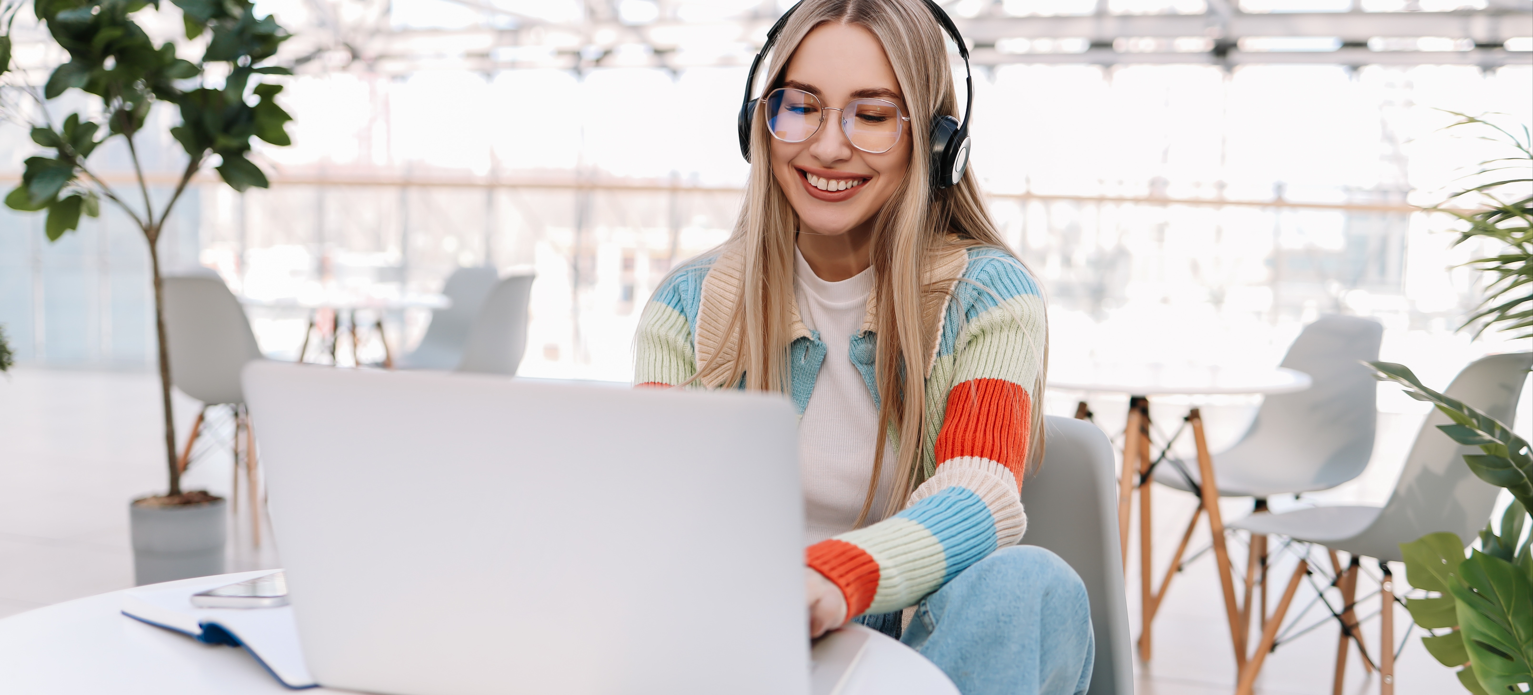 [Featured image] A person works on their laptop for their cybersecurity gaming industry job.  