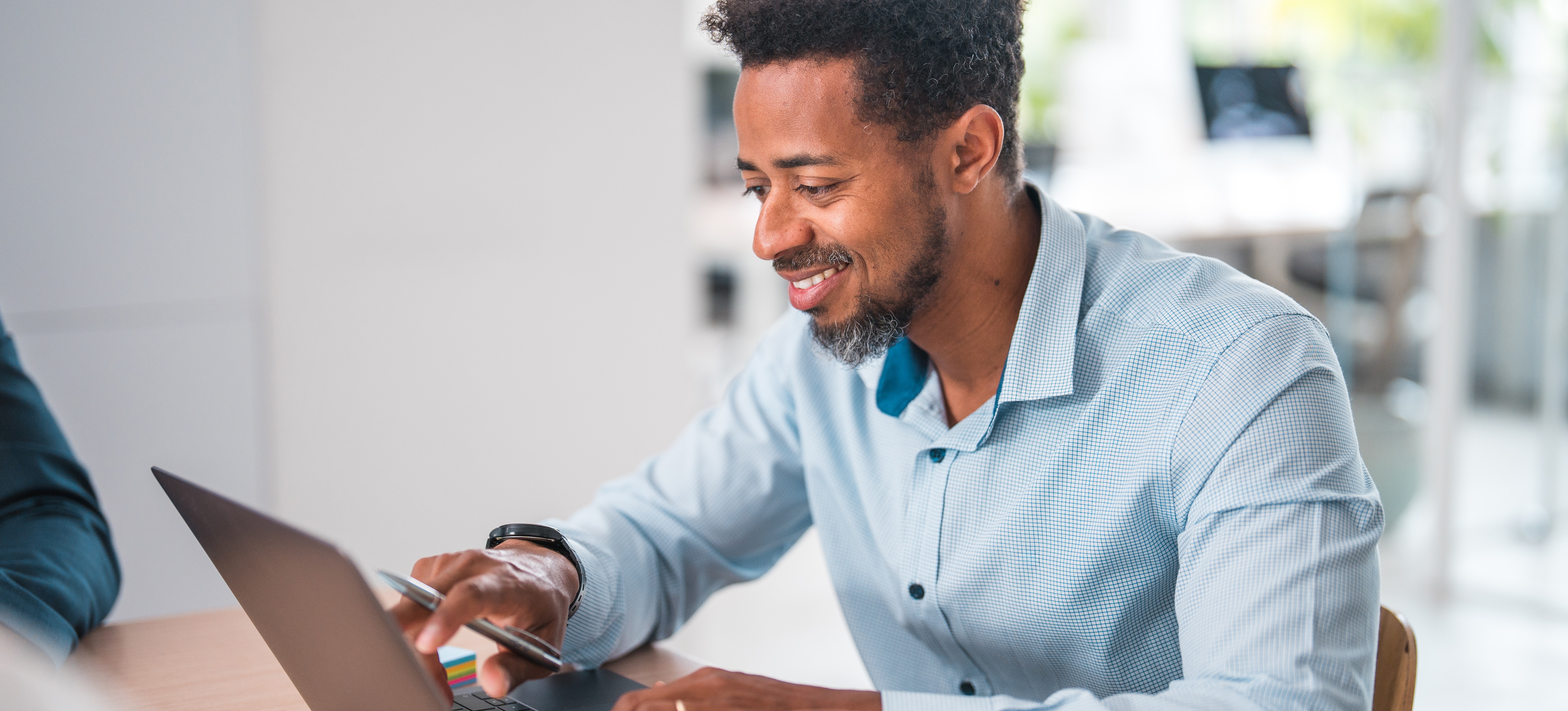 [Featured Image] A statistician goes over some autoregressive models on a laptop while sitting at a desk.