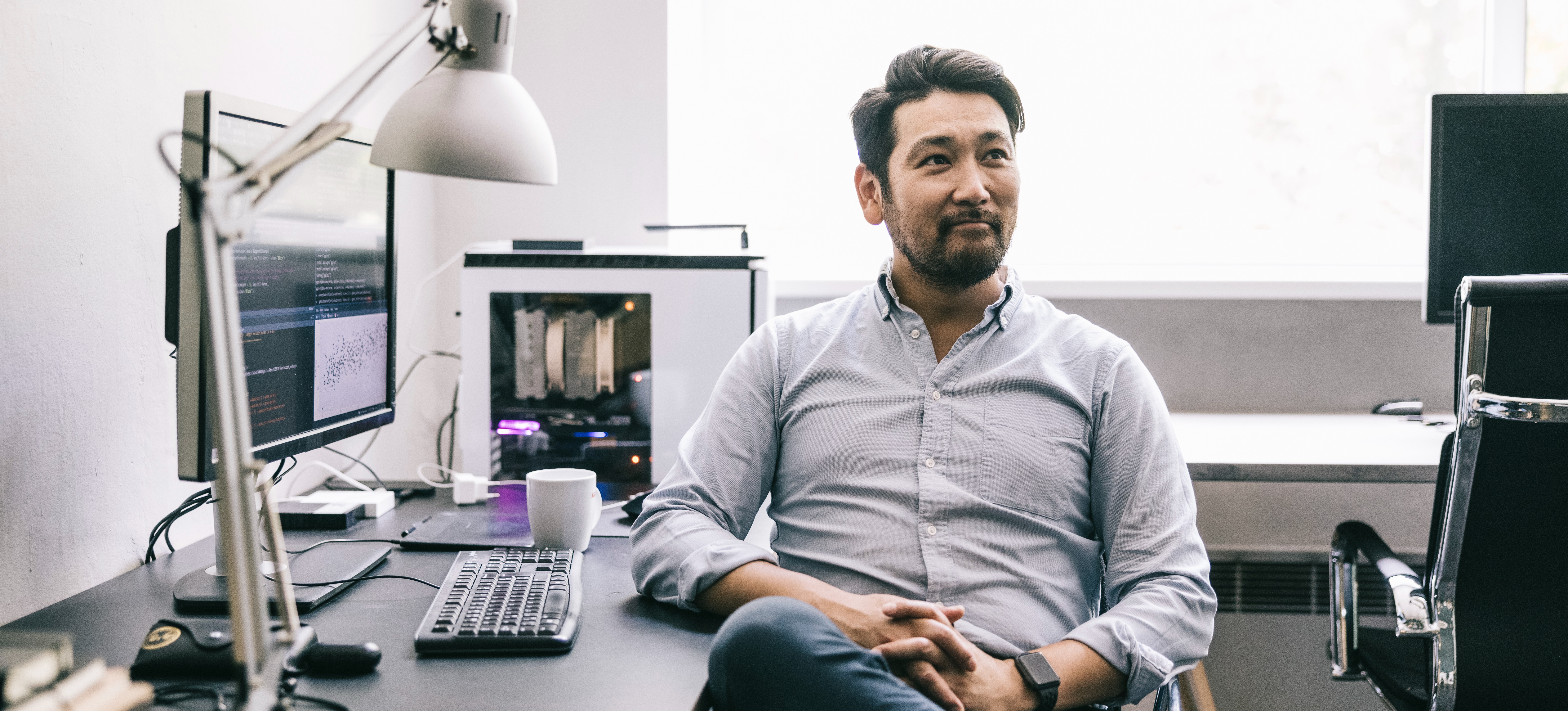 [Featured image] A machine learning engineer sits in his home office thinking about how to use decision trees in machine learning.

