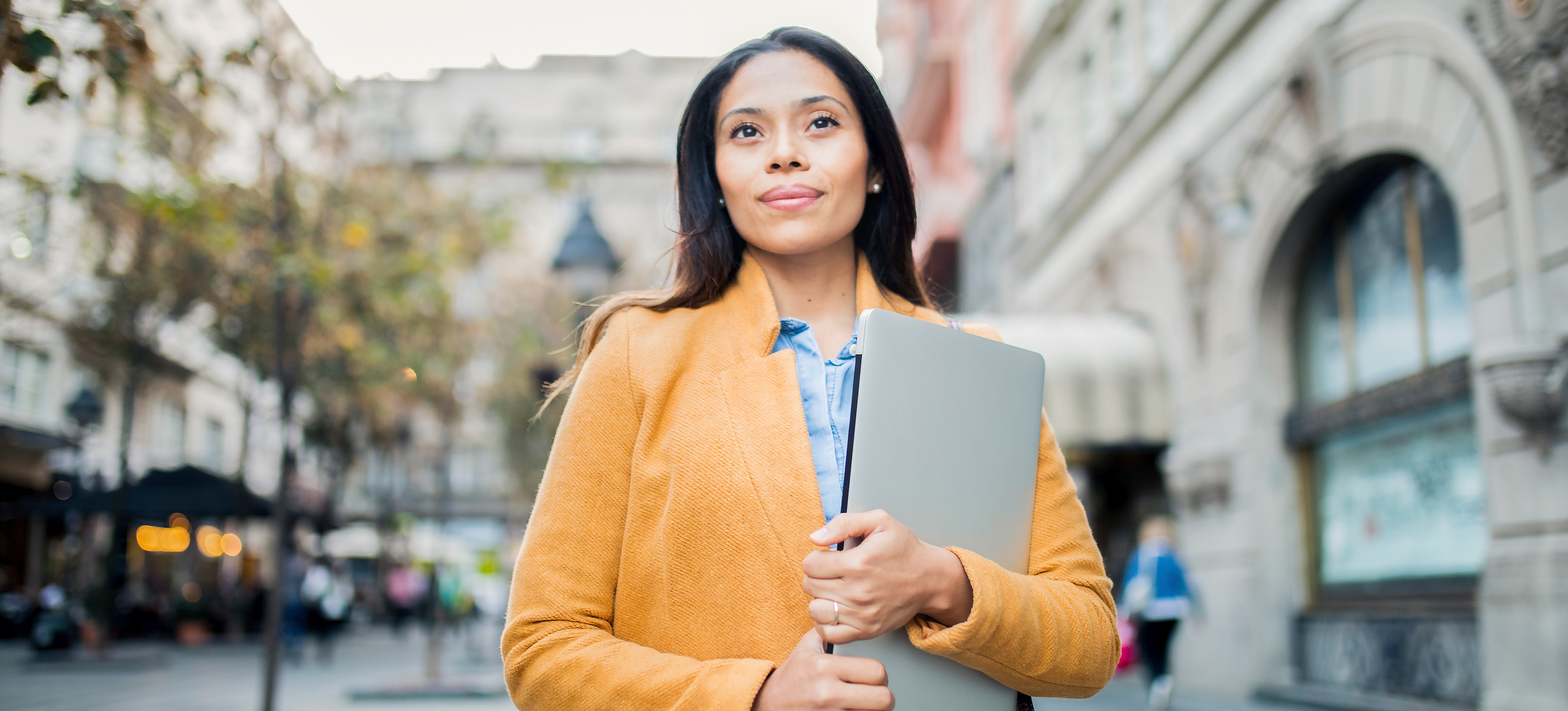 [Featured image] Real estate agent on sidewalk in front of property