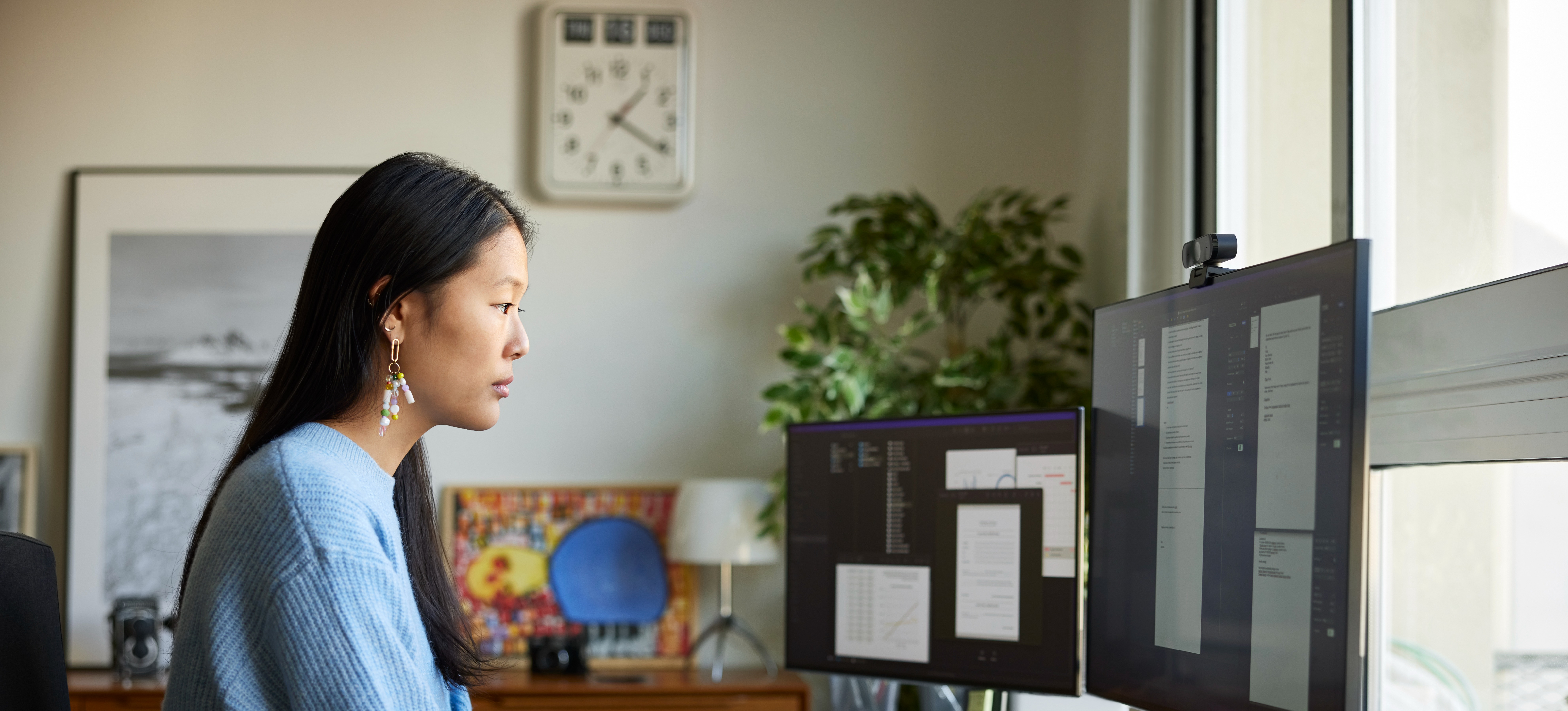 [Featured Image]: A person is sitting in front of her computer,  analyzing data for the health care organization they work for. 