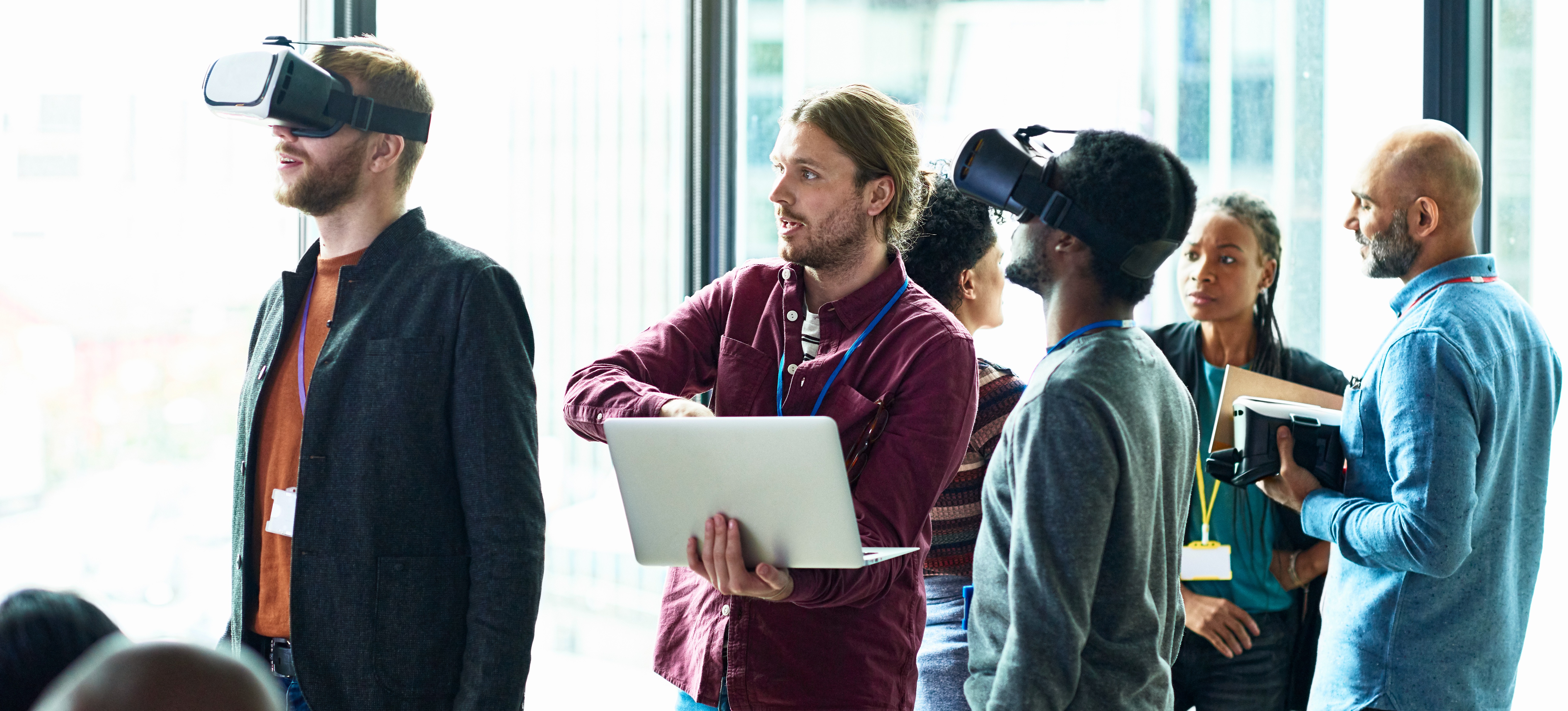 [Featured Image] A development team uses their newly learned technical and design VR skills to test updated hardware and software.
