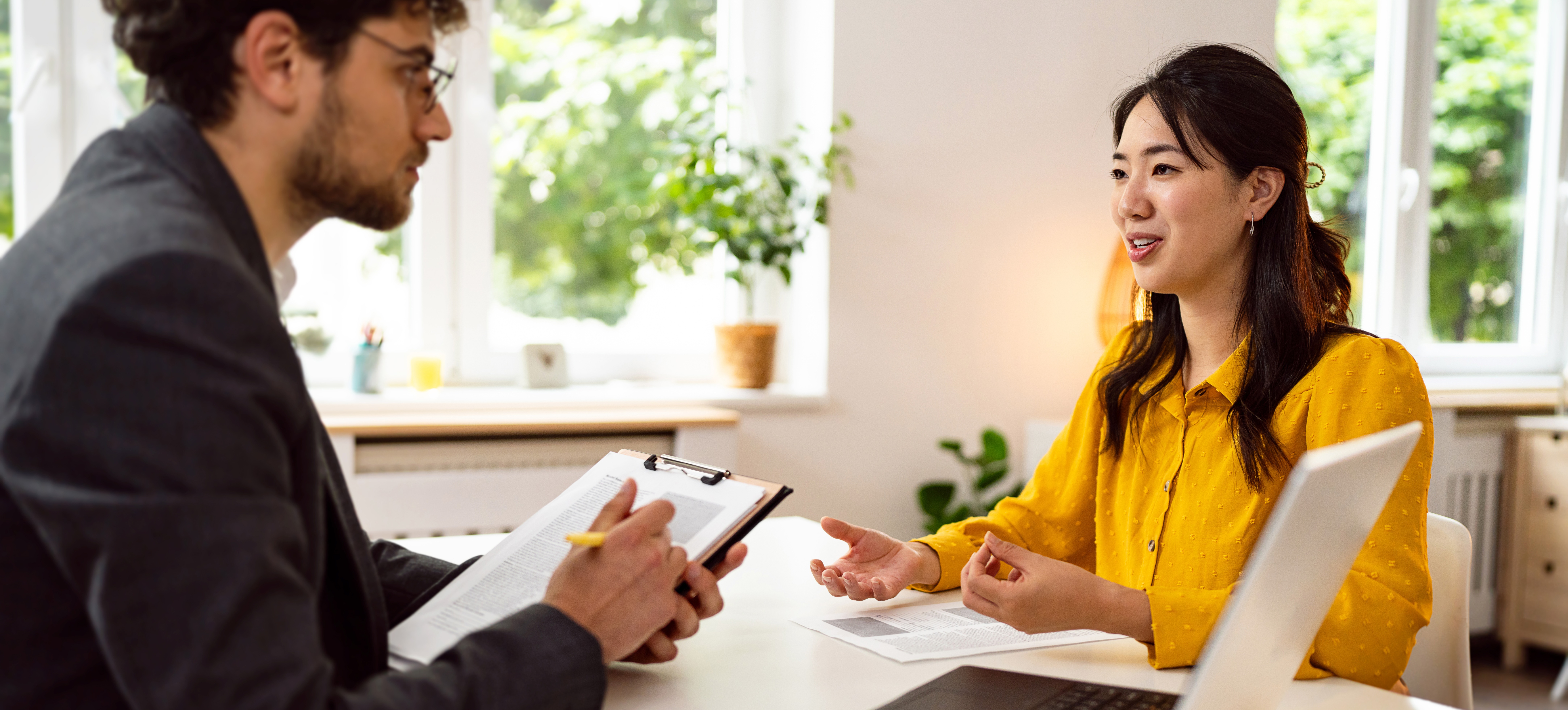 [Featured Image] A recruiter interviews a candidate for an HR generalist position.