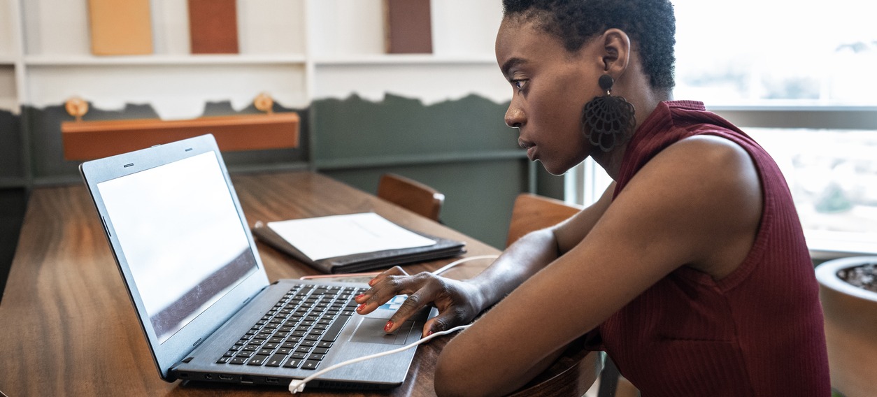 [Featured image] A marketer sits at a laptop examining a search engine results page (SERP).