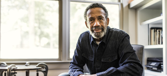 [Featured image] A job coach sits in a chair in his office leaning toward the camera and ready to learn about his new client.