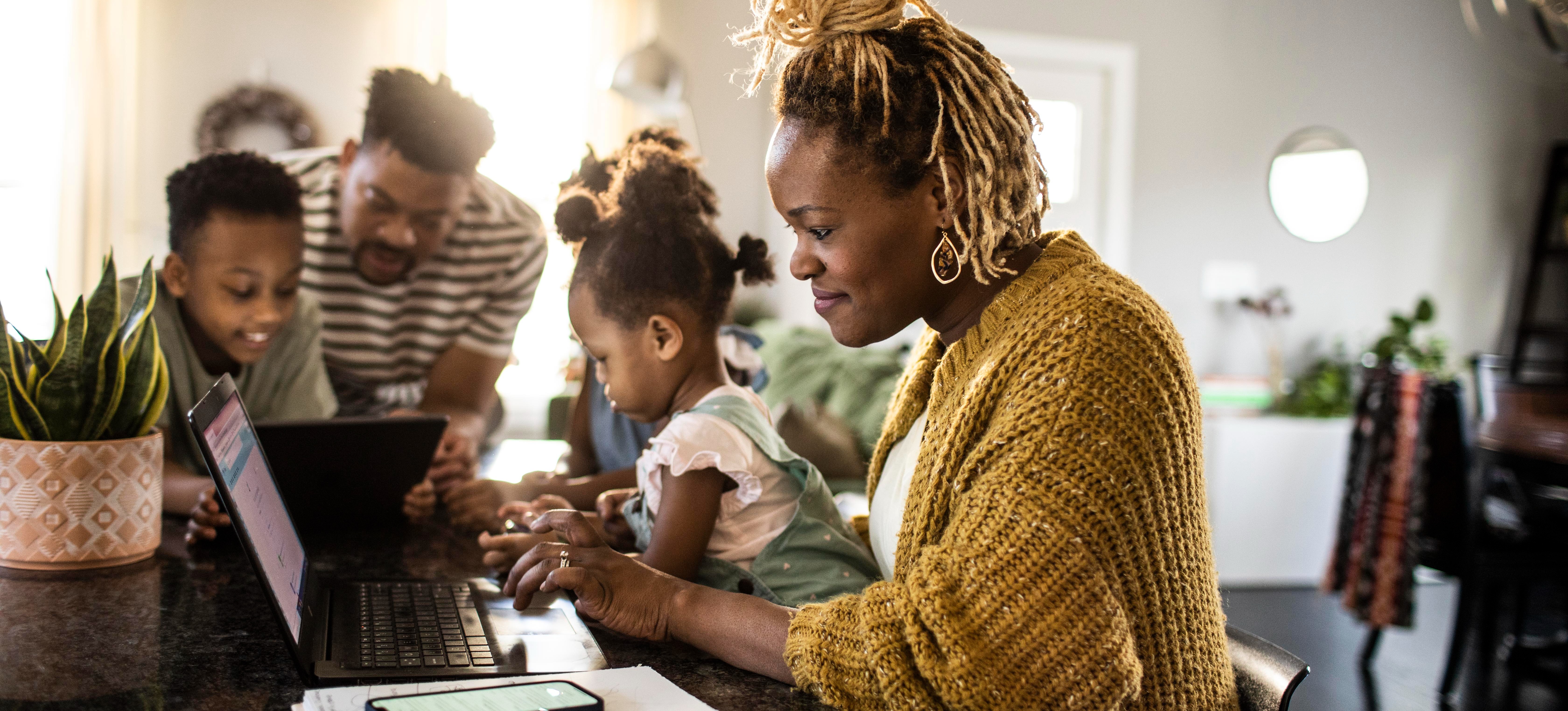 [Featured Image] An IT professional studies at home for their CompTIA Network+ certification as part of their strategy to further their career. 
