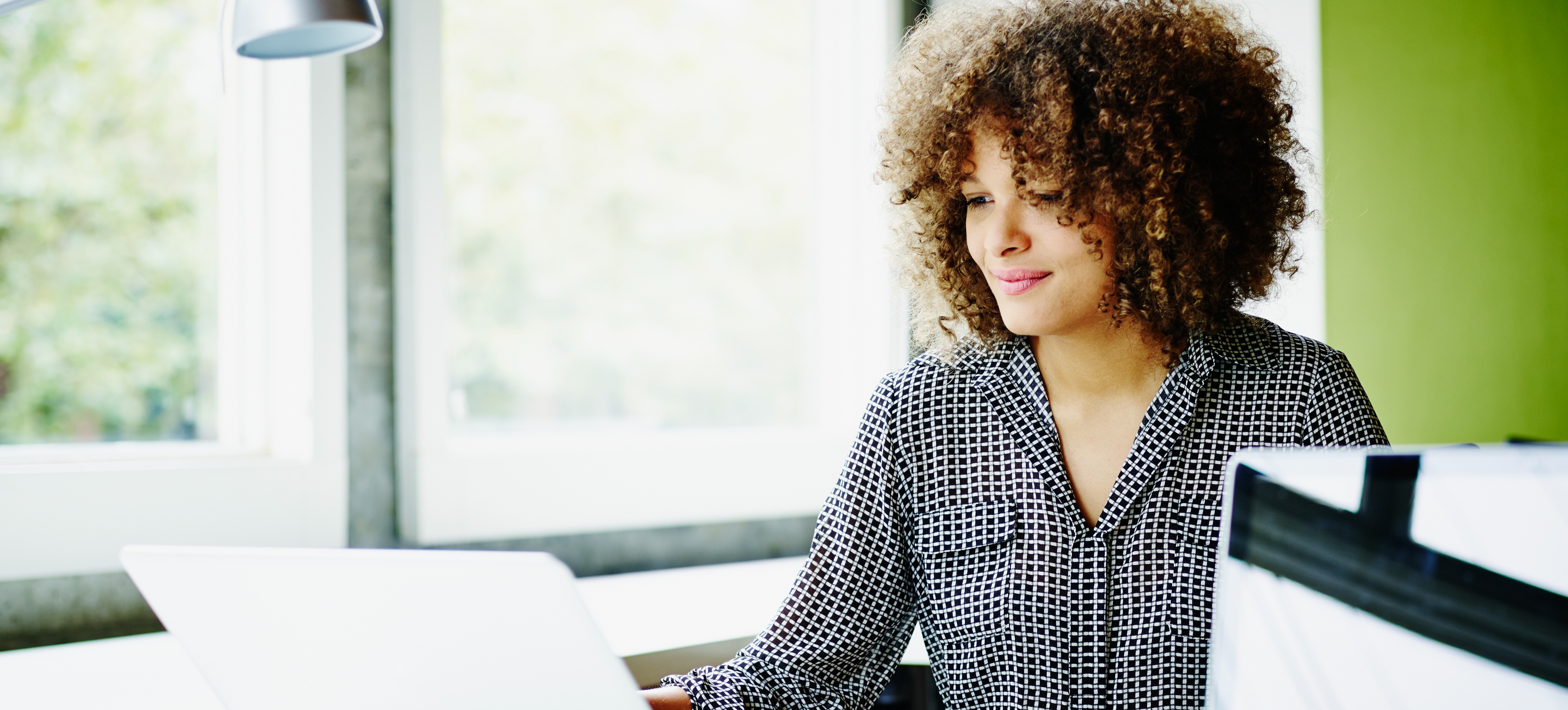 [Feature Image] A learner studies on a laptop as part of an online course designed to help them develop deep learning skills.
