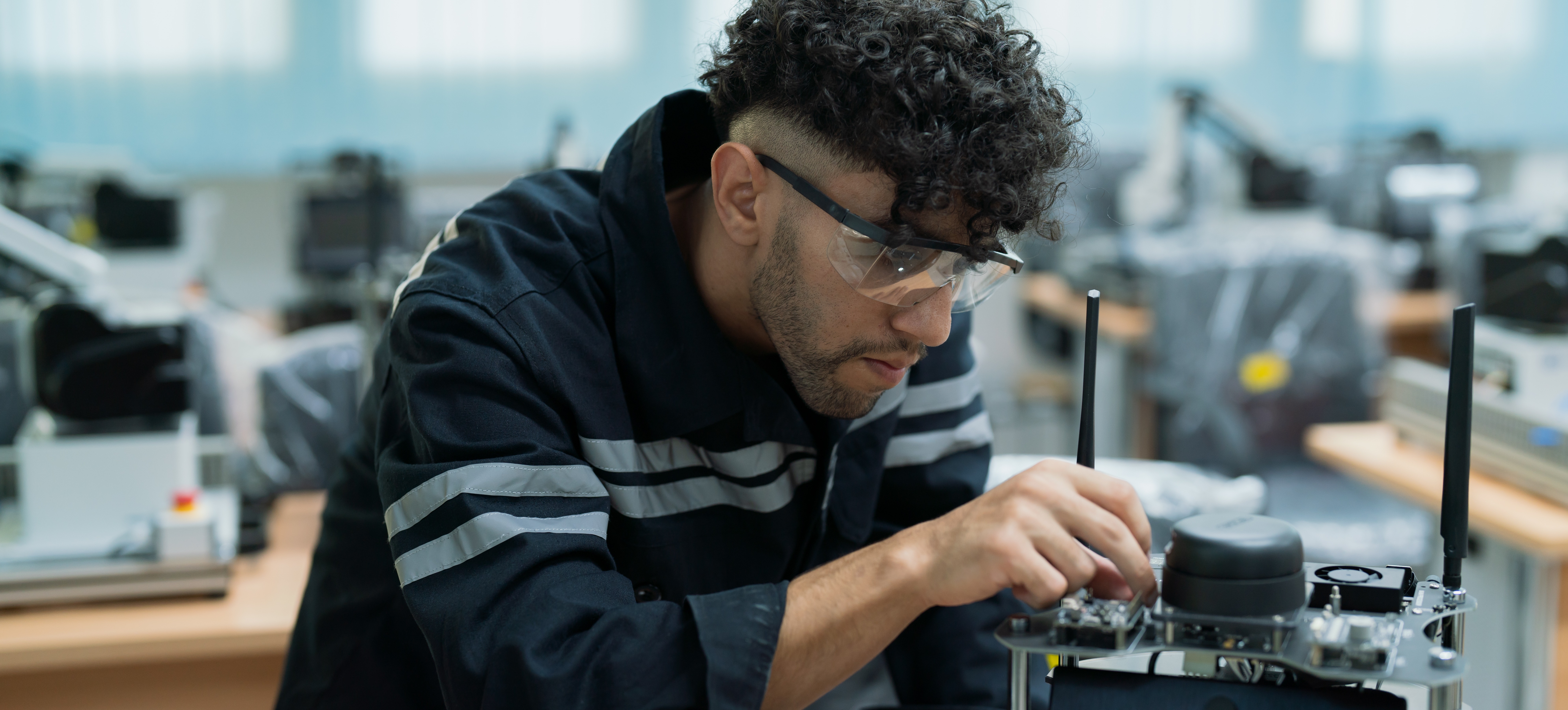 [Featured Image] A computer engineer is programming the appropriate batch size on a computer.

