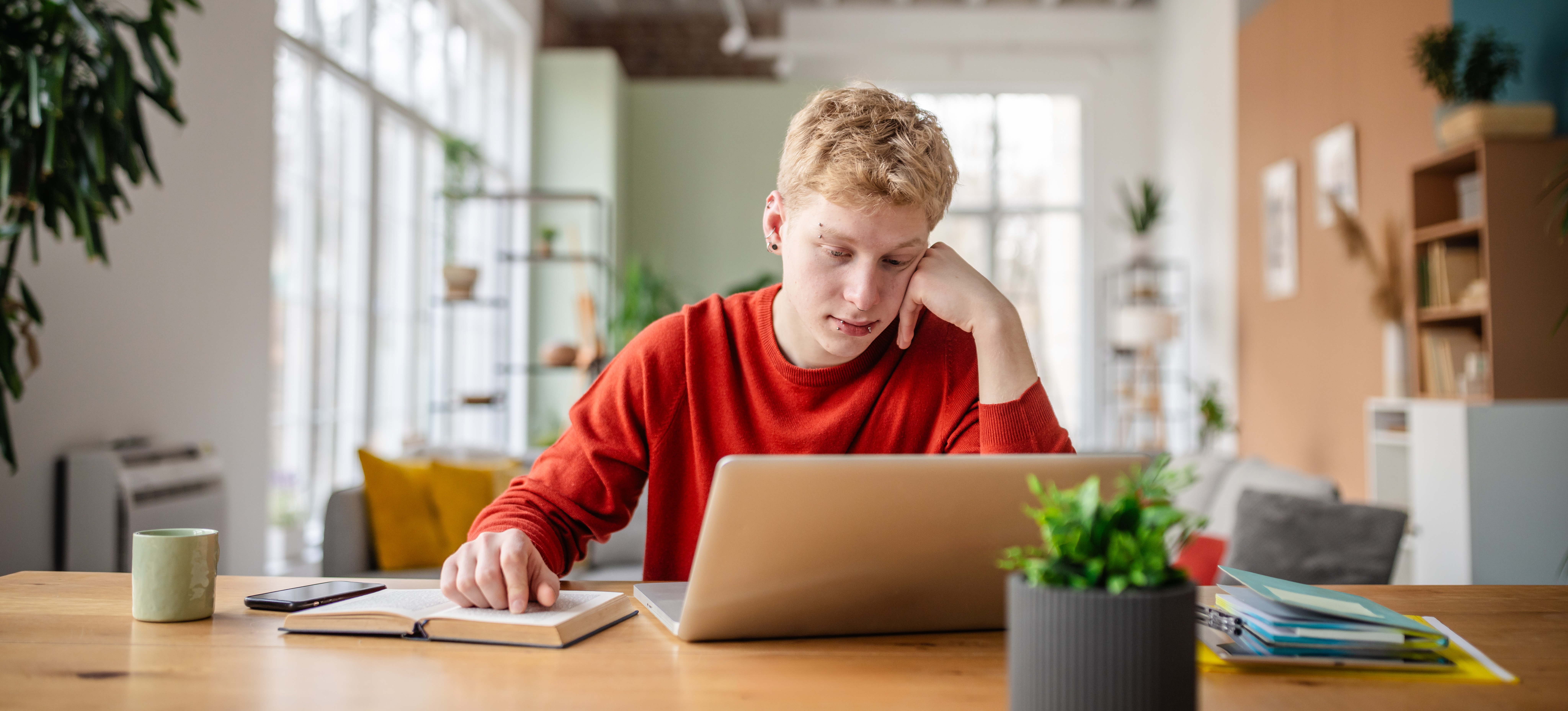 [Featured Image] An aspiring professional engineer sits at a desk with study materials, preparing for the NCEES PE exam.
