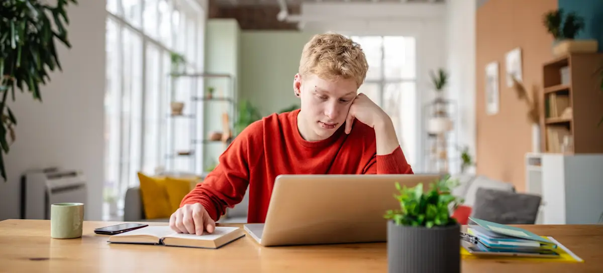 [Featured Image] An aspiring professional engineer sits at a desk with study materials, preparing for the NCEES PE exam.
