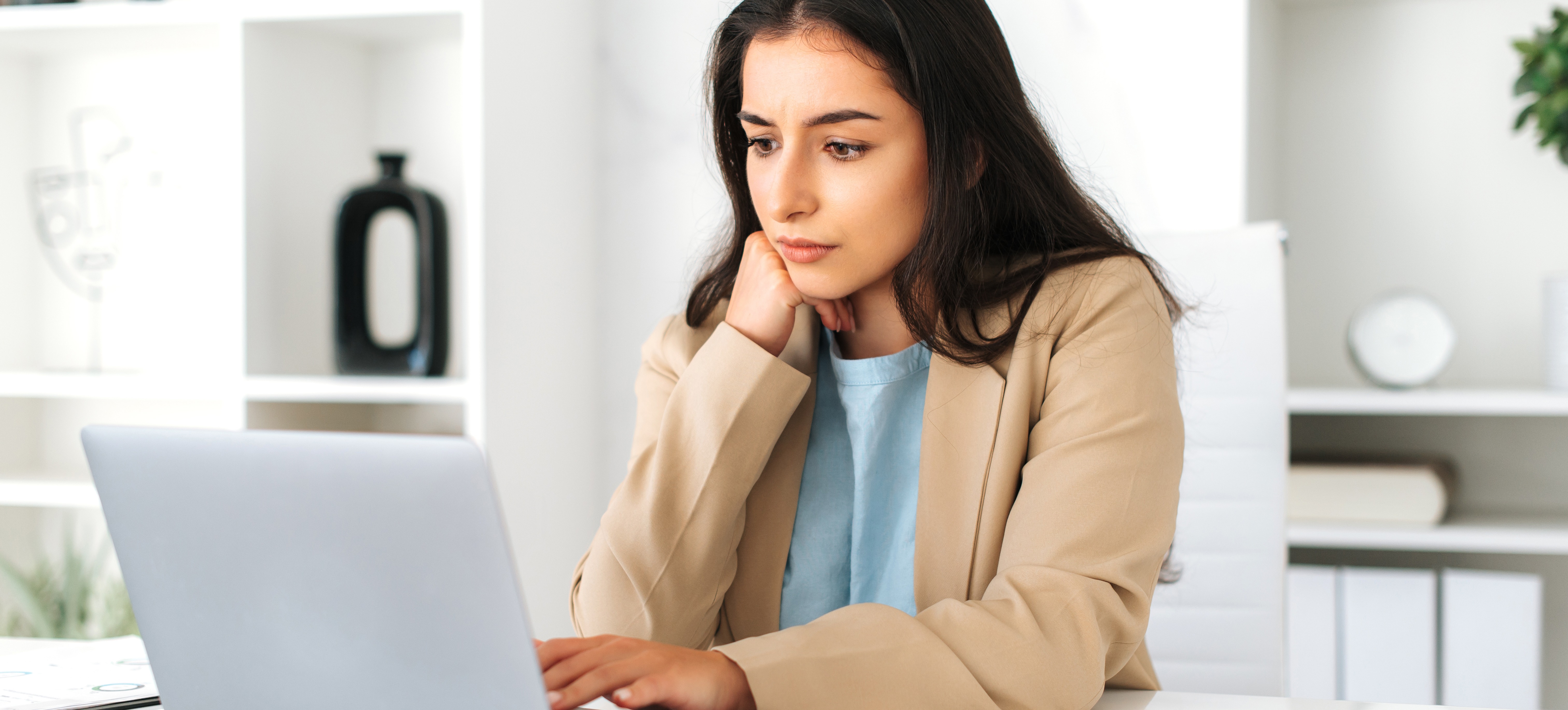 [Featured Image] A programmer studies data encryption on her computer.