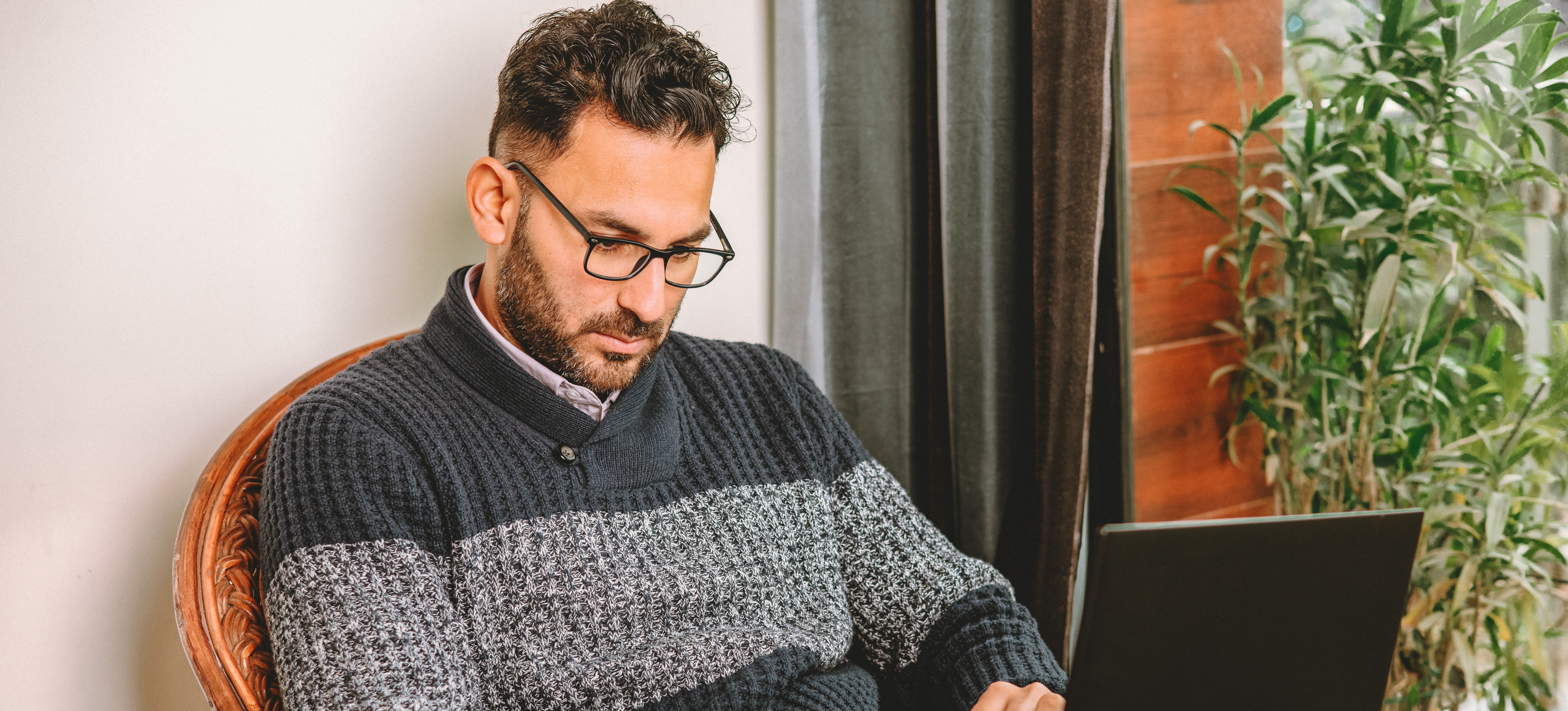 [Featured Image]: A back-end developer checks the code he writes for a website to ensure it's working as expected.
