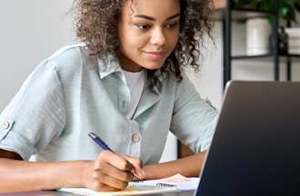 [Featured Image] A person with curly hair and a pale blue shirt takes a course on how to become a data scientist.