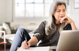 [Featured image] An IT support specialist is on their laptop taking notes on FAT32.