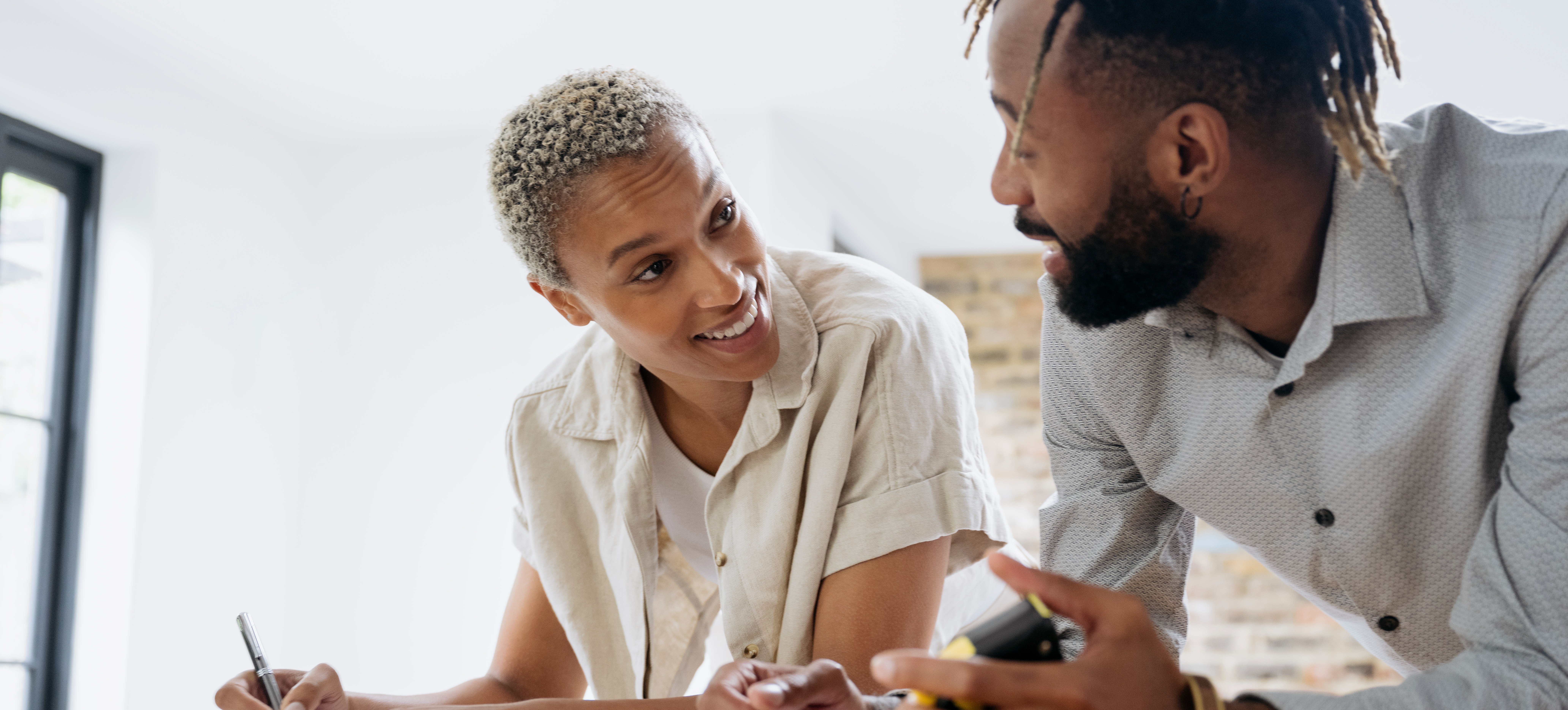 [Feature Image] A job seeker meets with their mentor to discuss how to best write a generative AI resume to stand out from competitors and highlight their expertise.
