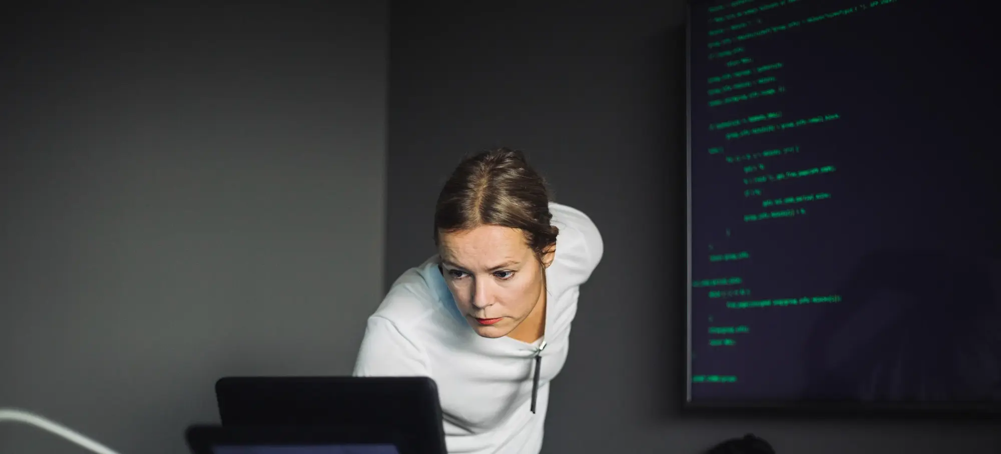 [Featured Image]: An SOC analyst responding to a cyber-related threat on a business computer system.