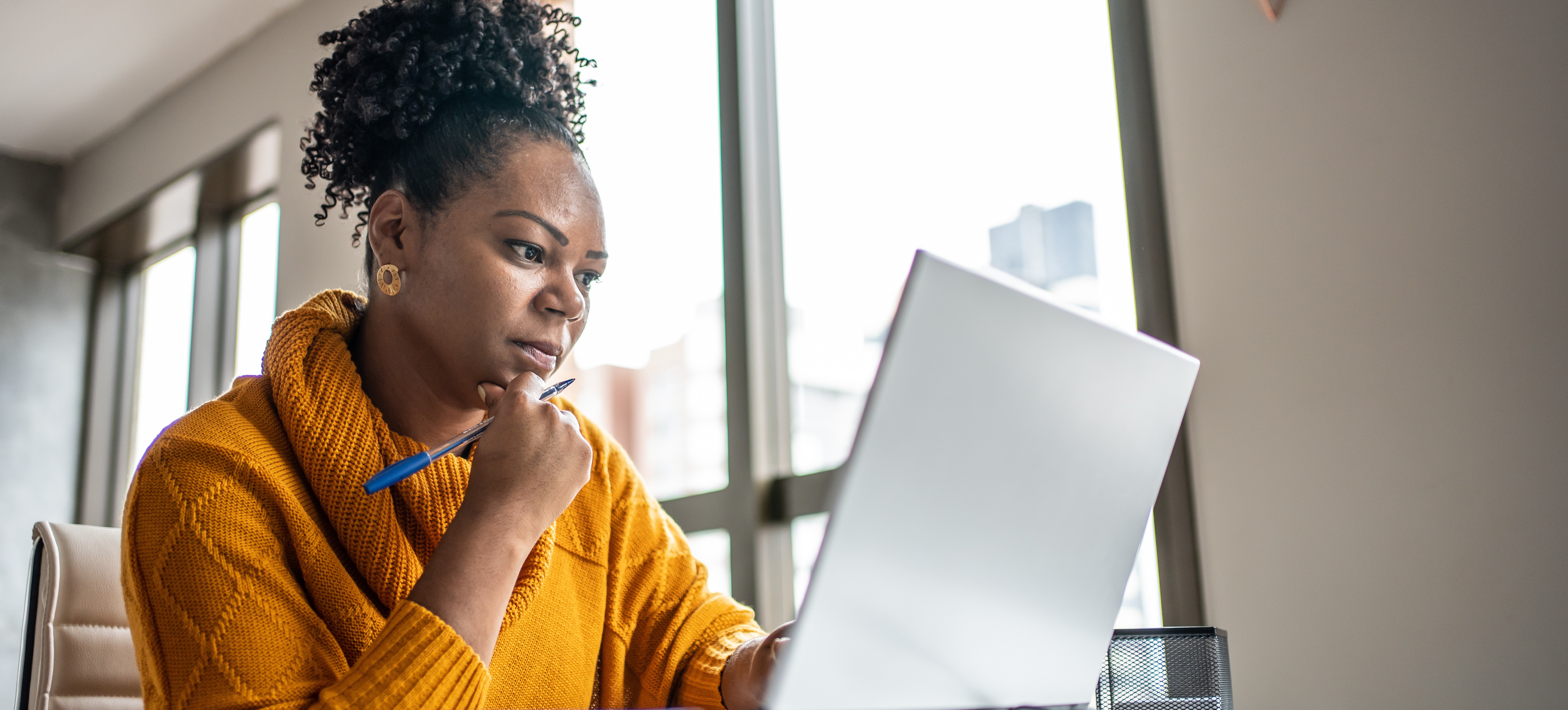 [Featured Image] A business owner uses Google My Business to enhance their digital marketing strategy and reach out to customers.
