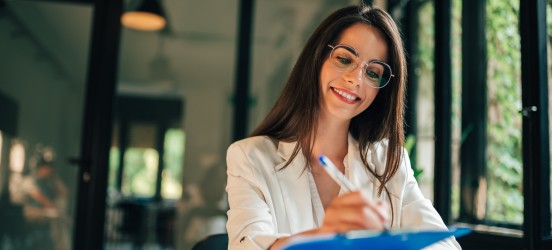 [Featured image] Smiling job applicant adds hobbies to a standout CV.