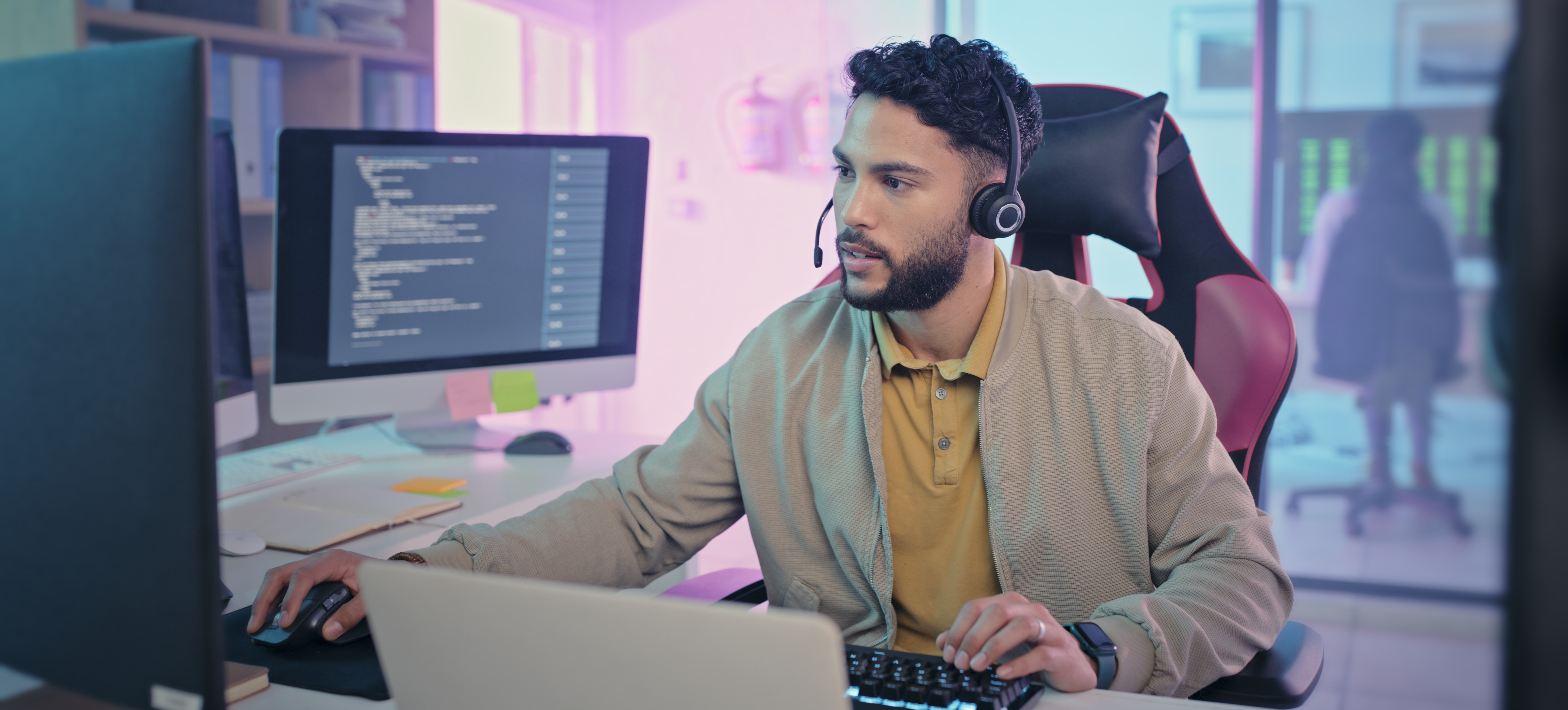 [Featured Image] A cryptanalyst is at a workstation, analyzing data on computer monitors.
