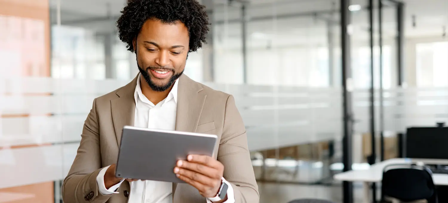[Featured Image] A professional considering a career change researches the average cybersecurity analyst salary.