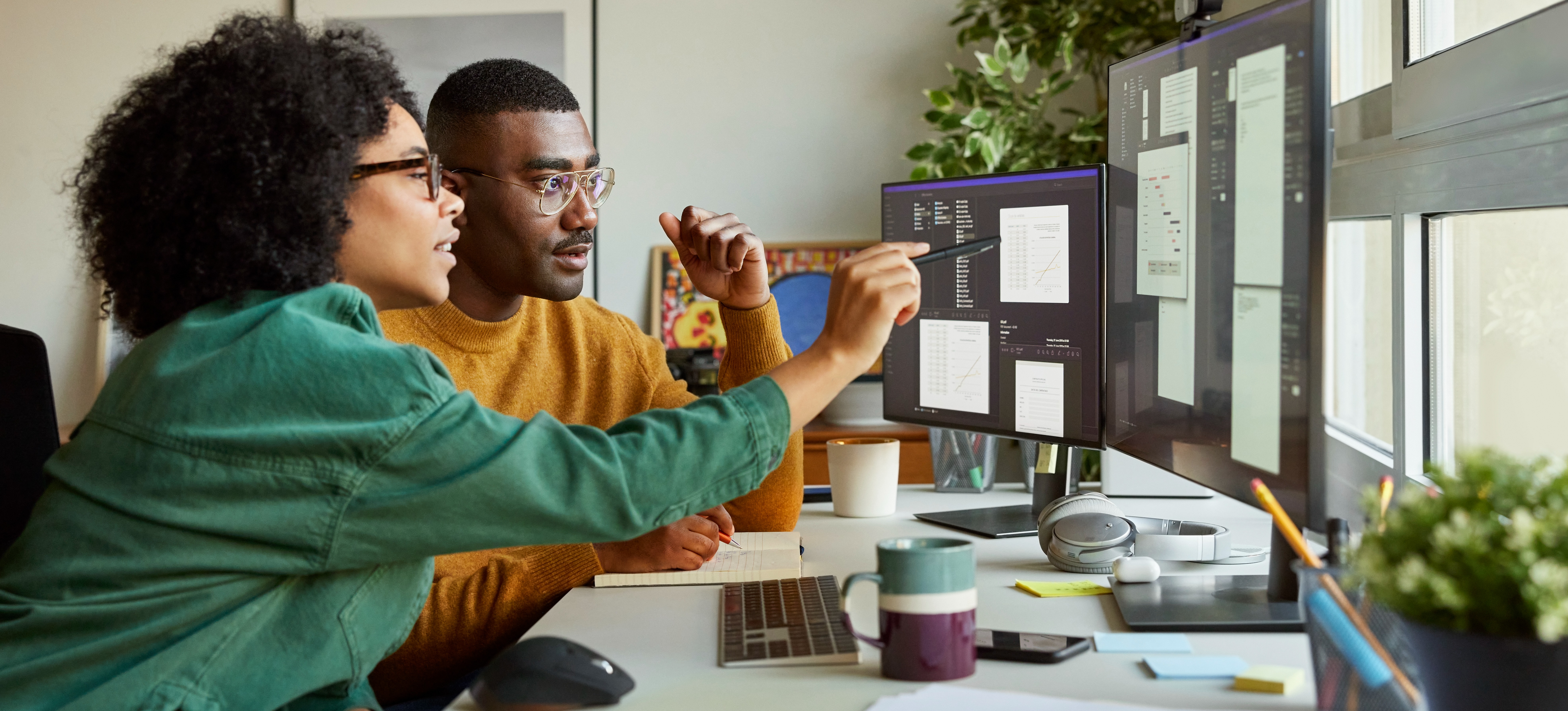 [Featured image]: Two people sitting in front of monitors use data cleaning tools to prepare data for analysis.
