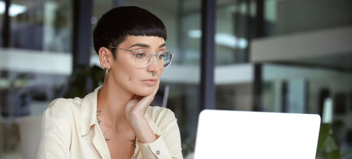[Featured Image]: Motion graphics designer working on a project at a computer.