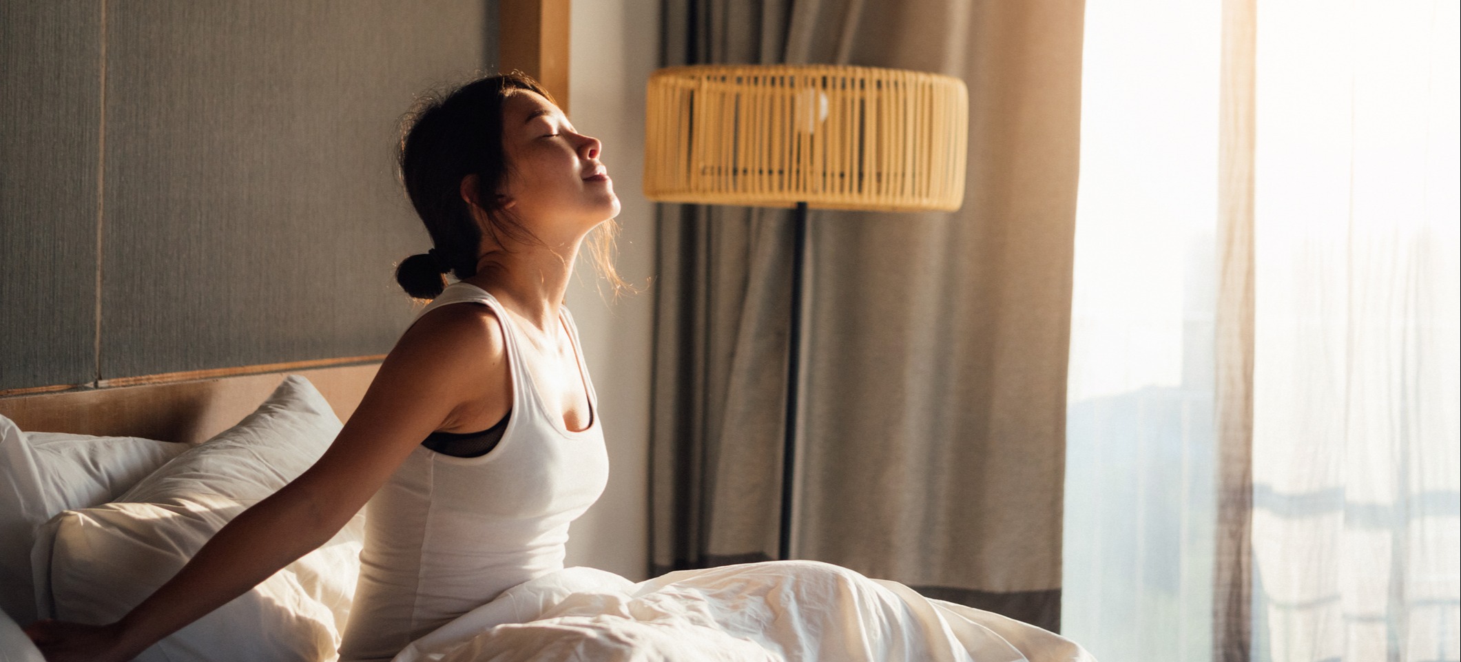 [Featured Image] A person wakes up feeling refreshed.