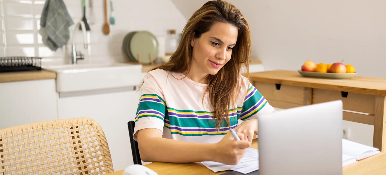 [Featured Image] A machine learning engineer uses their laptop at home to review their knowledge of large language models.