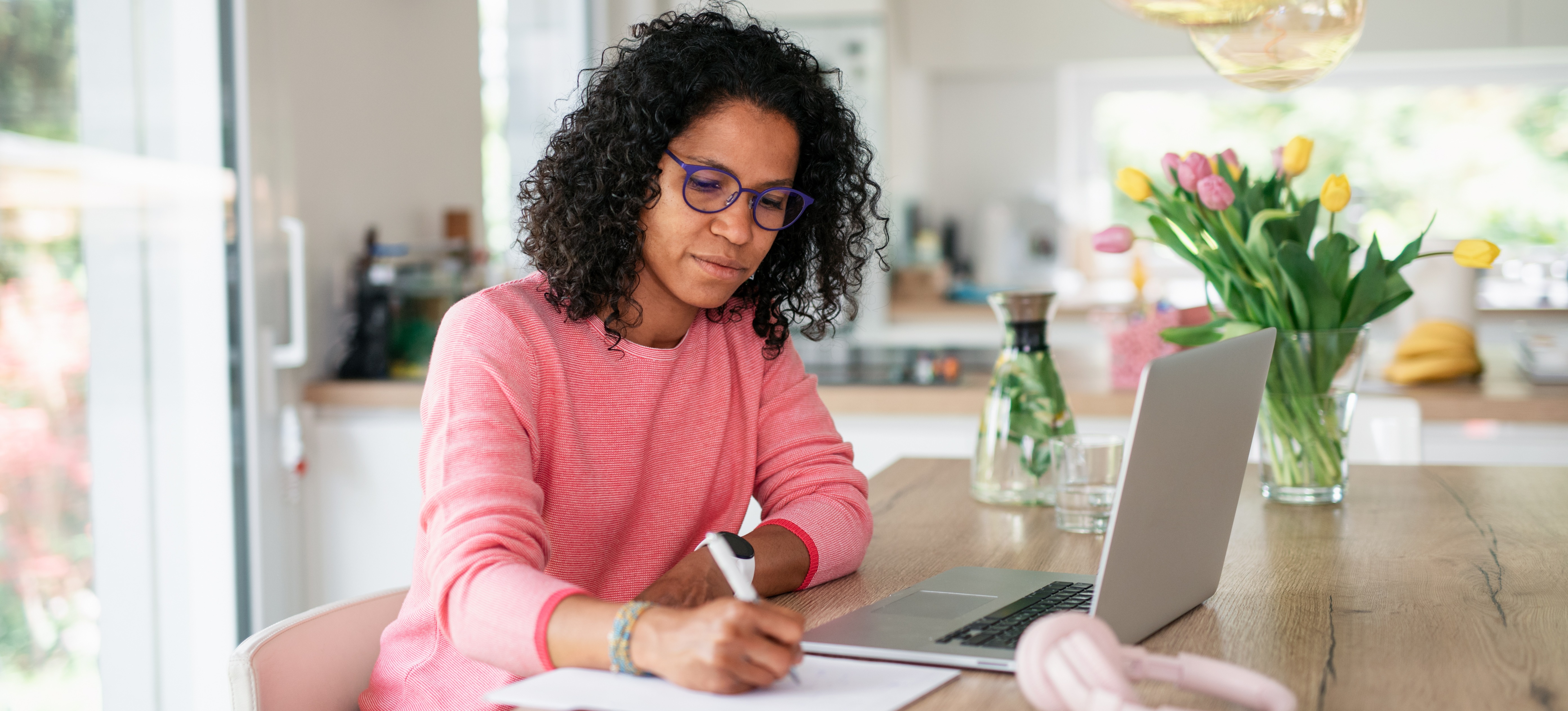 [Feature Image] An aspiring systems engineer studies at home on their laptop as they prepare for a systems engineering certification. 
