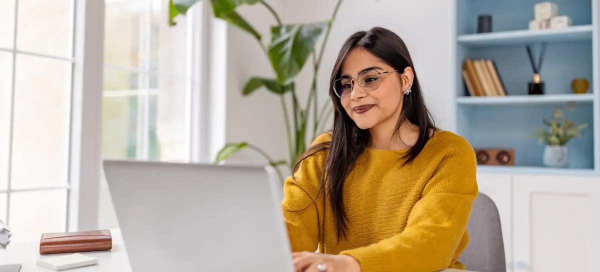 [Featured Image] A person in a home office studies for a professional certificate on a laptop.
